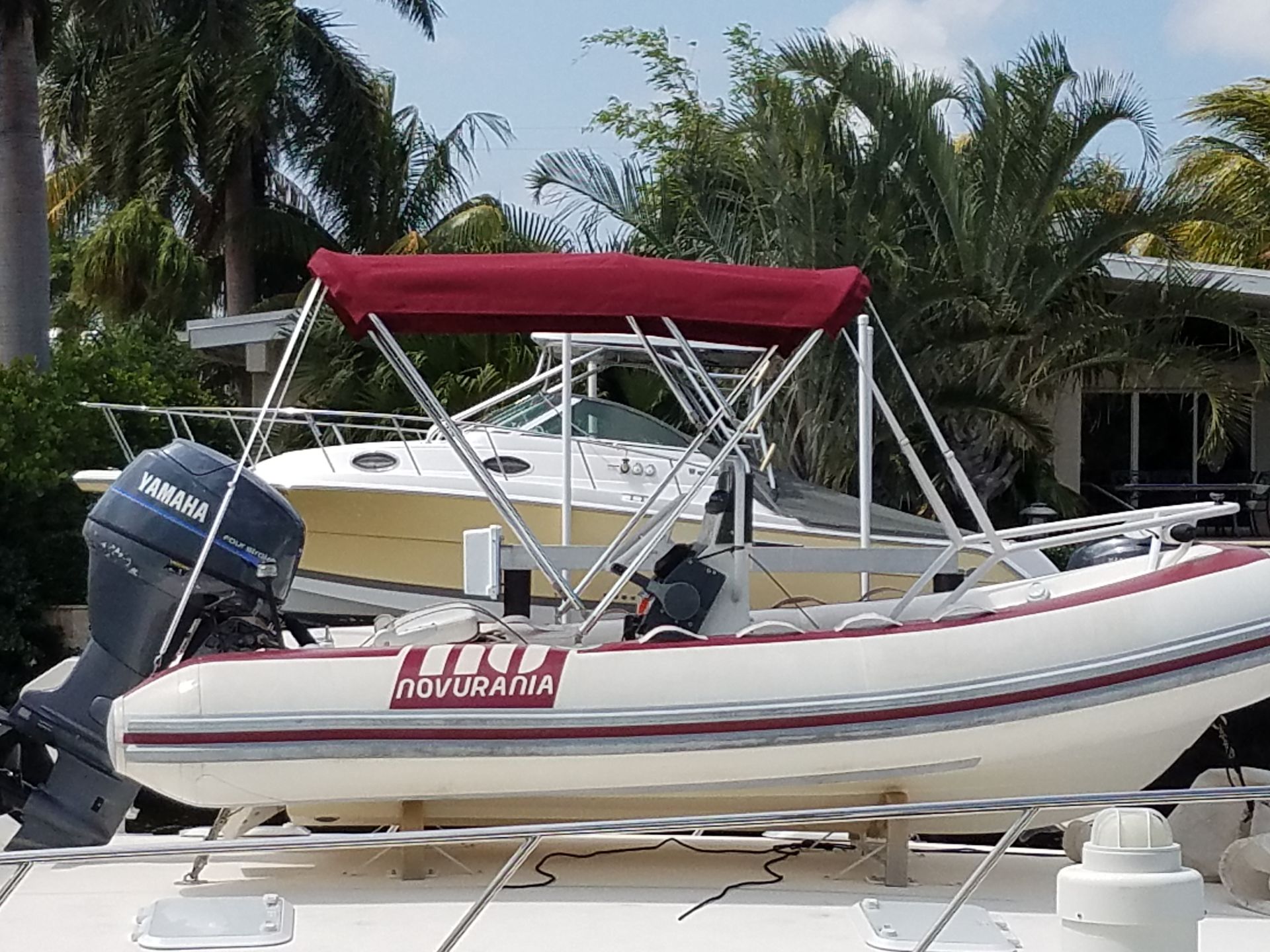 A boat with a red canopy on top of it