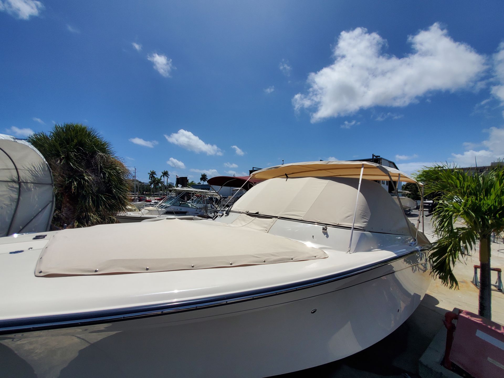 A boat is parked in a marina on a sunny day.