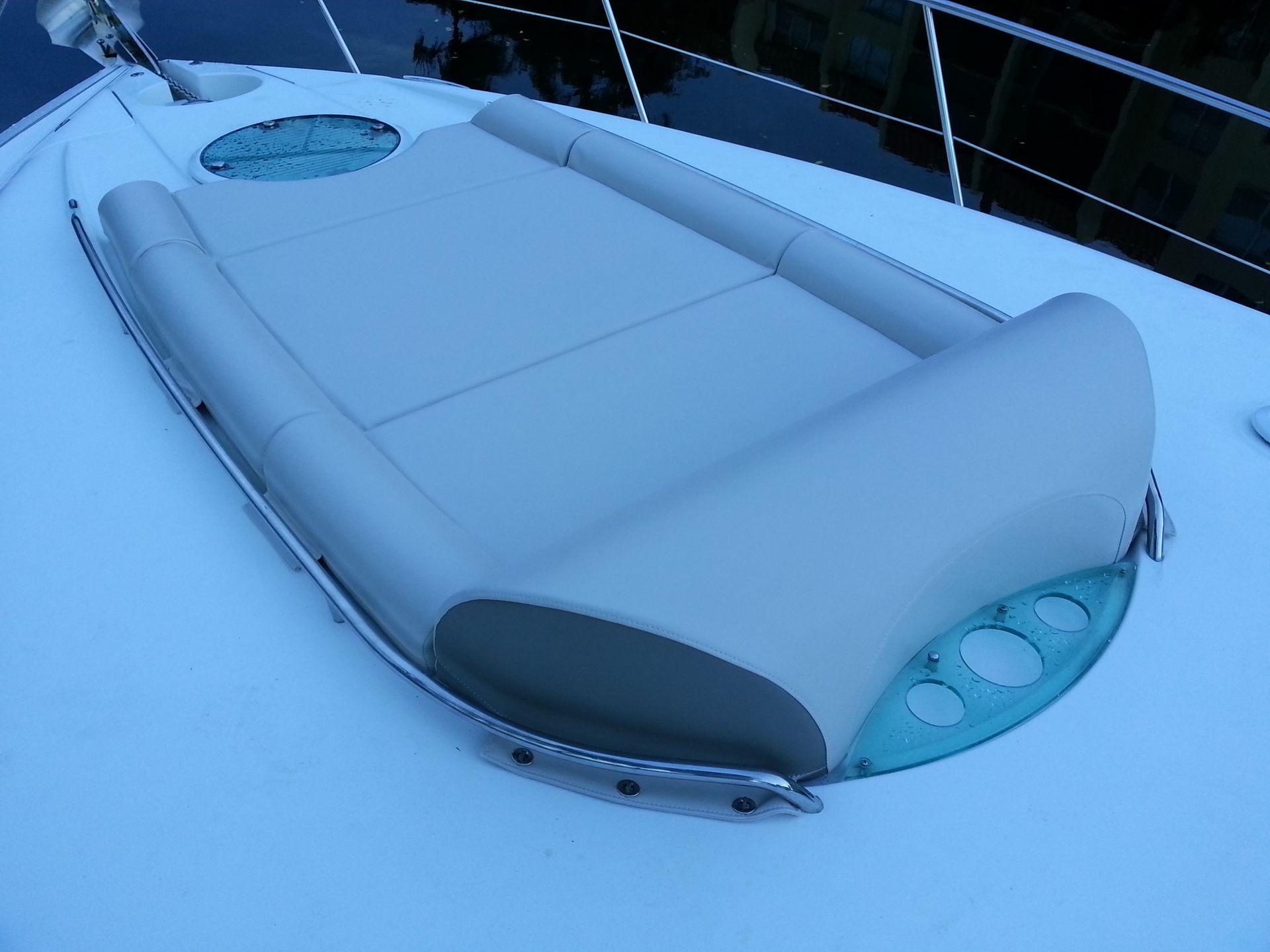 A boat with a couch on the side of it