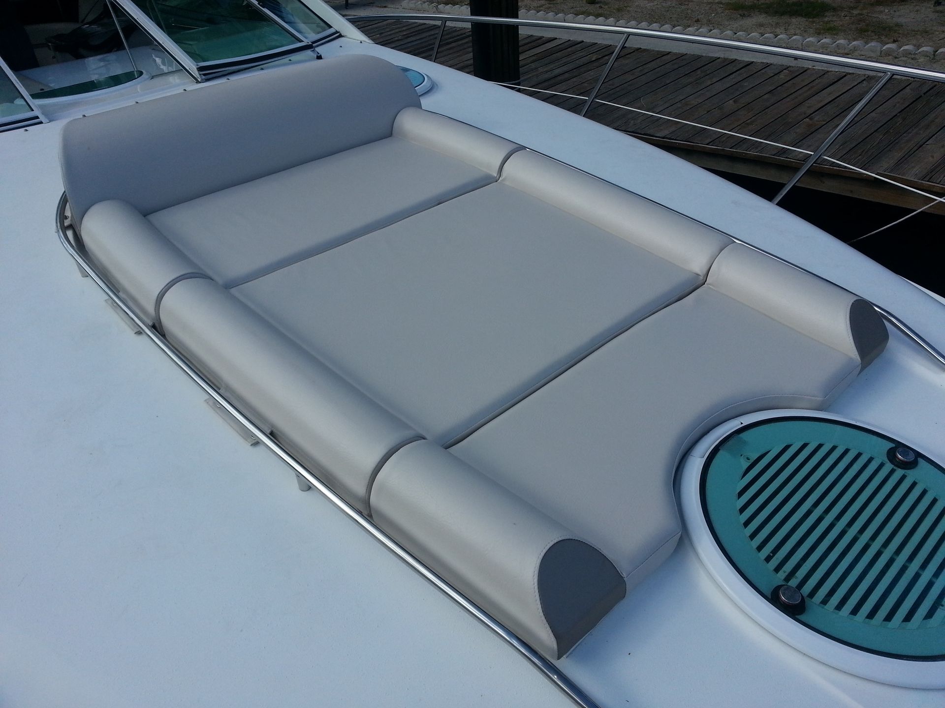 A boat with a cushion on the back of it