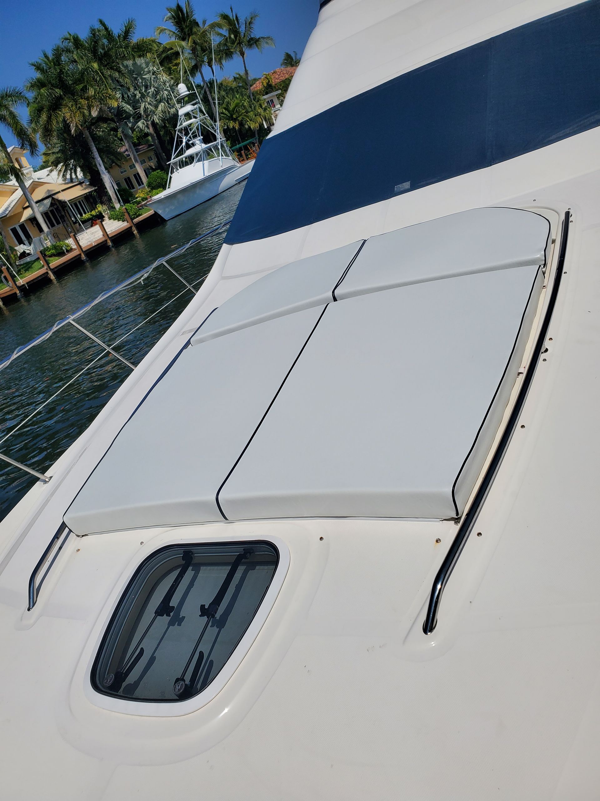 A boat with a white cushion on the back of it