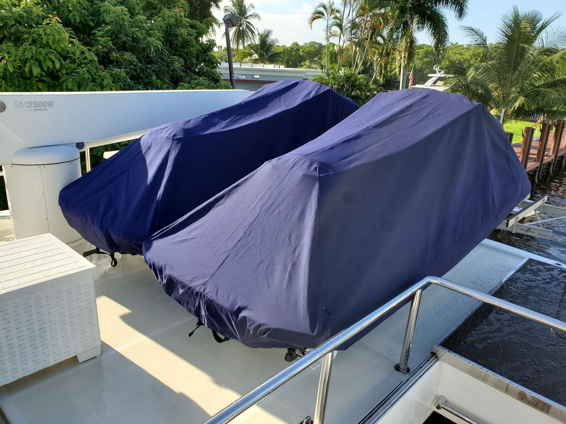 A boat with a blue cover on top of it