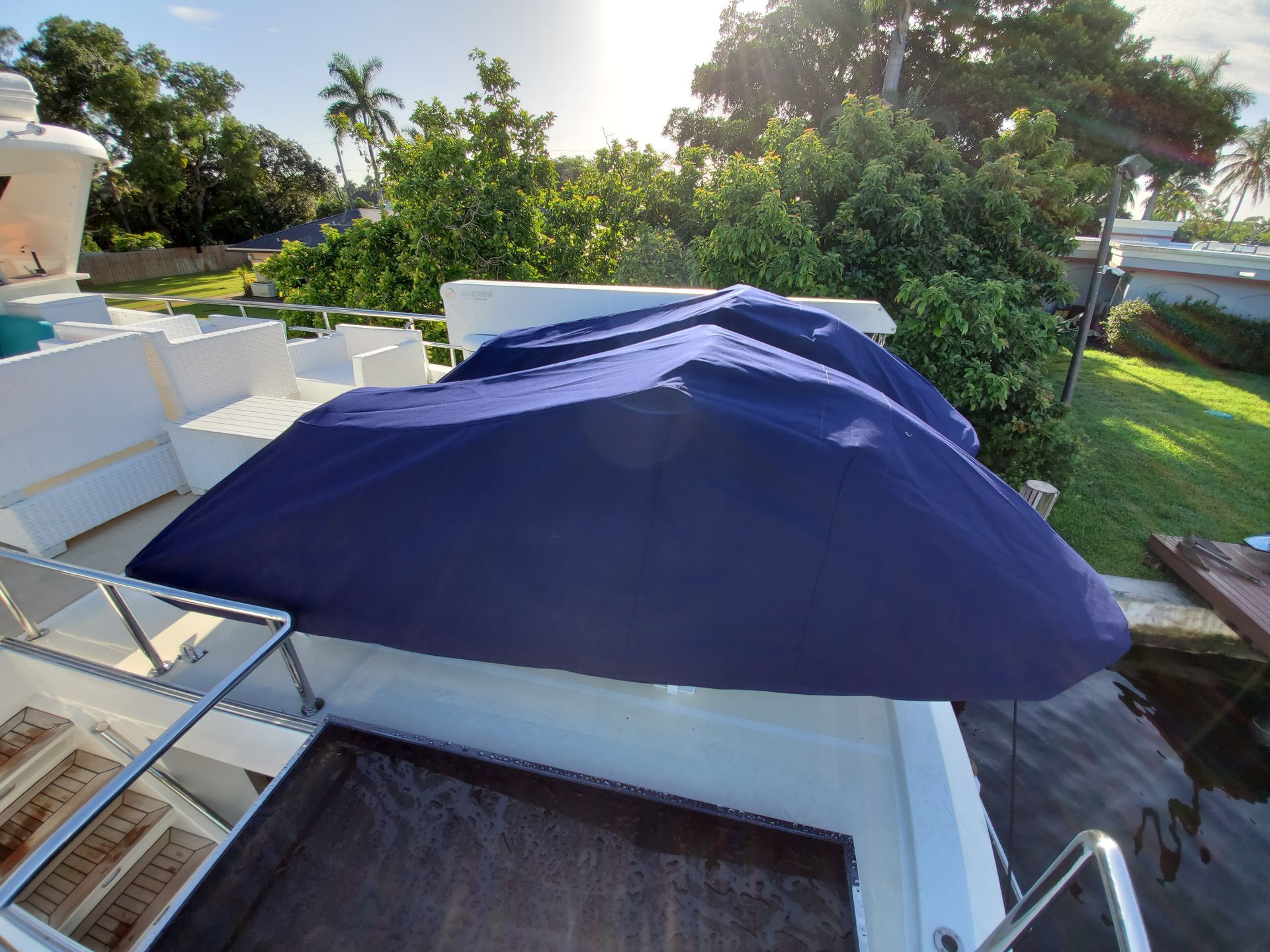 A boat with a blue umbrella on top of it