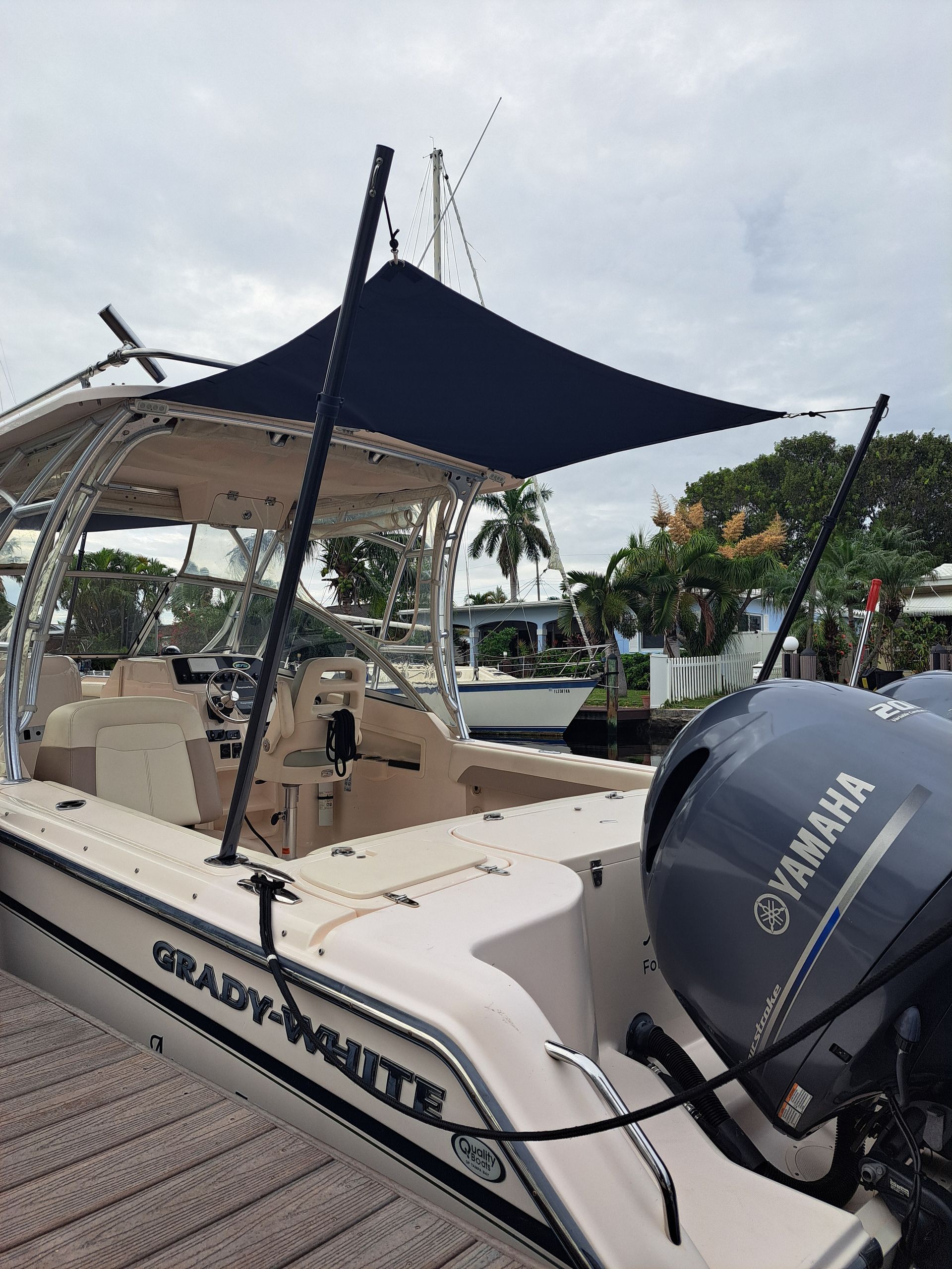 A boat with a yamaha engine is parked on a dock