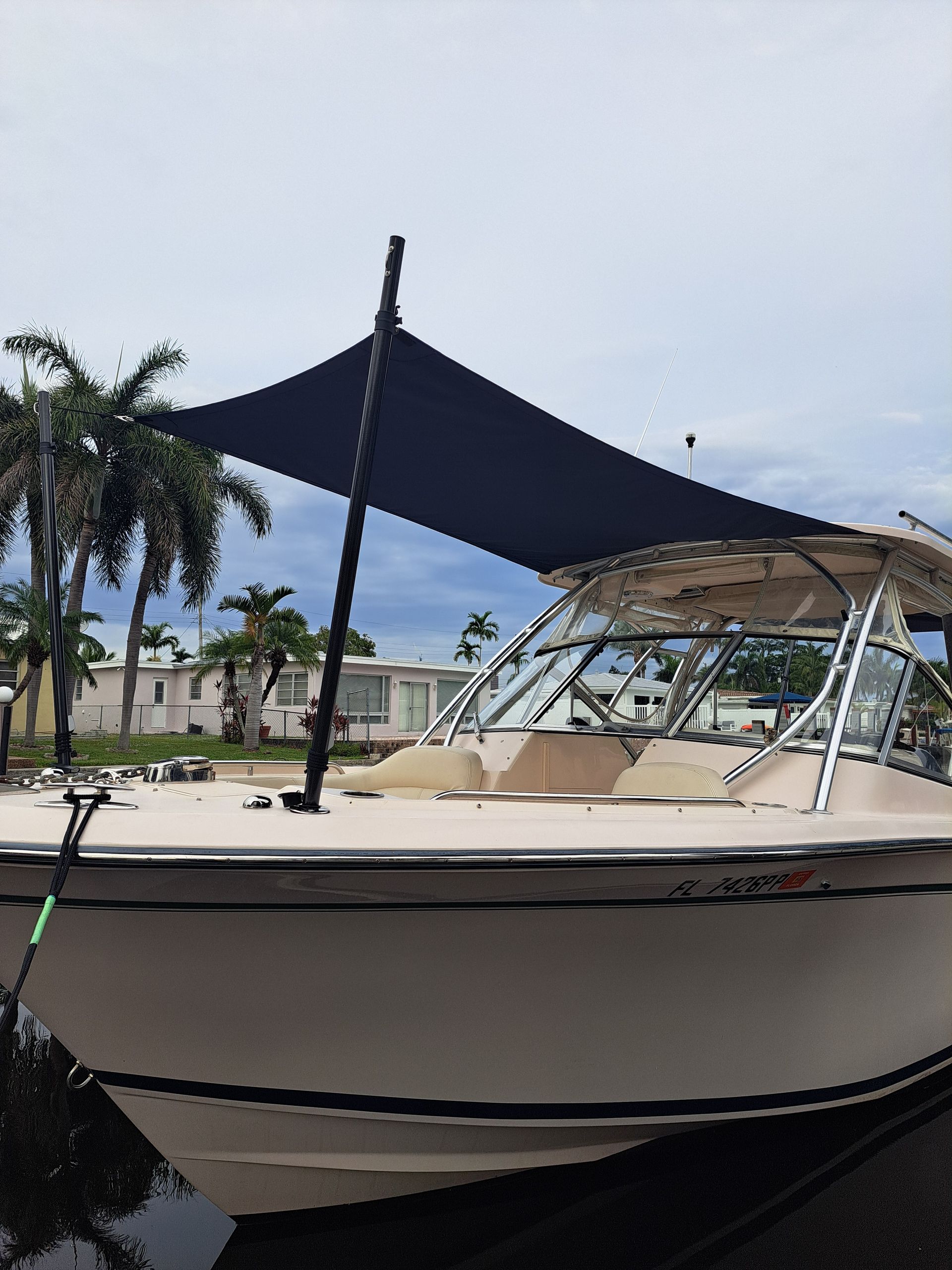 A boat with a blue canopy on top of it