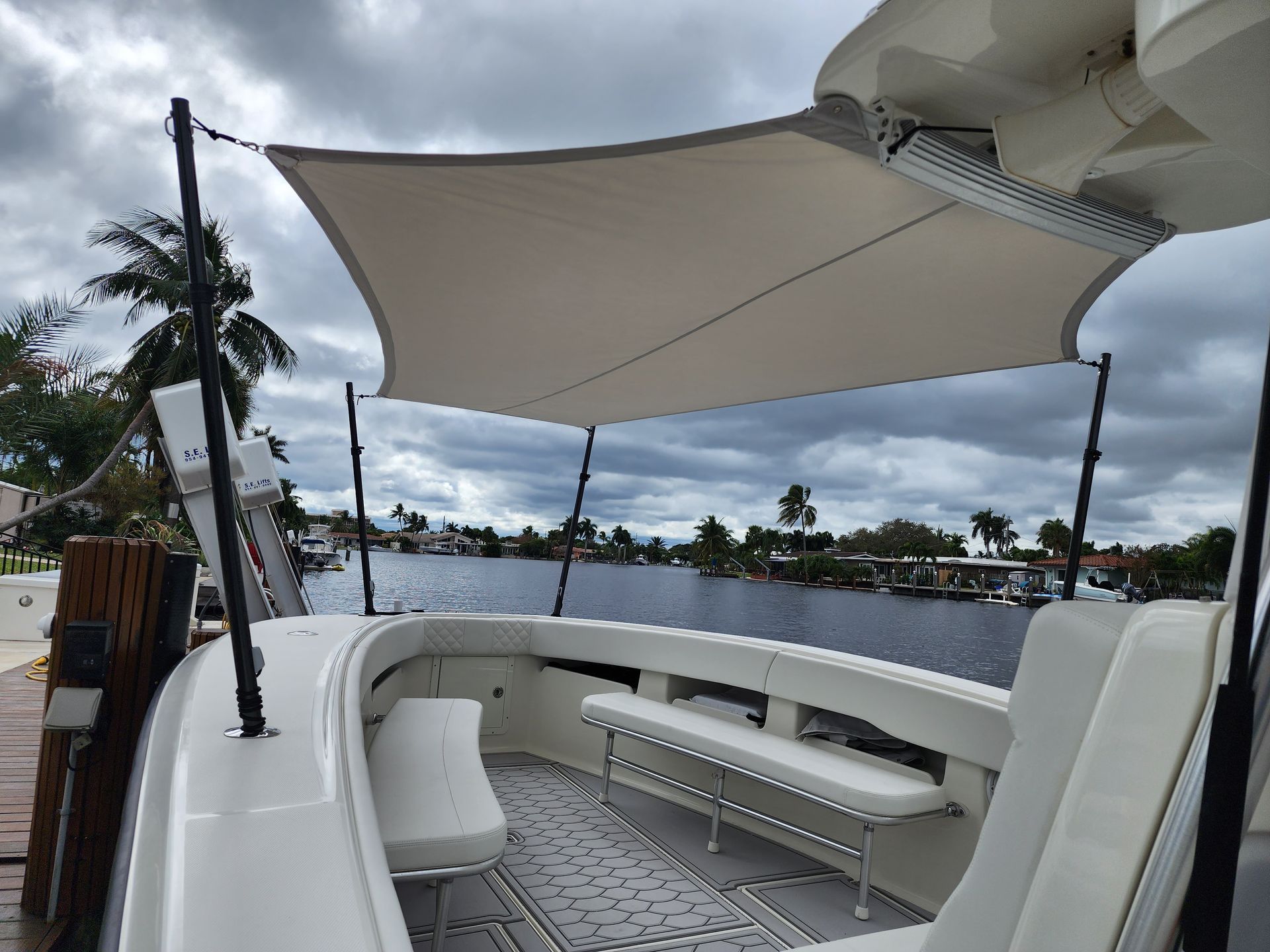 A boat with a white umbrella on top of it.