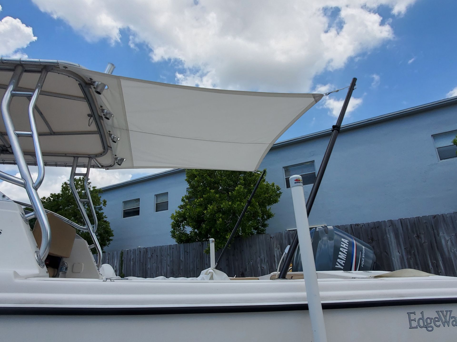 A white boat with the word edge on the side