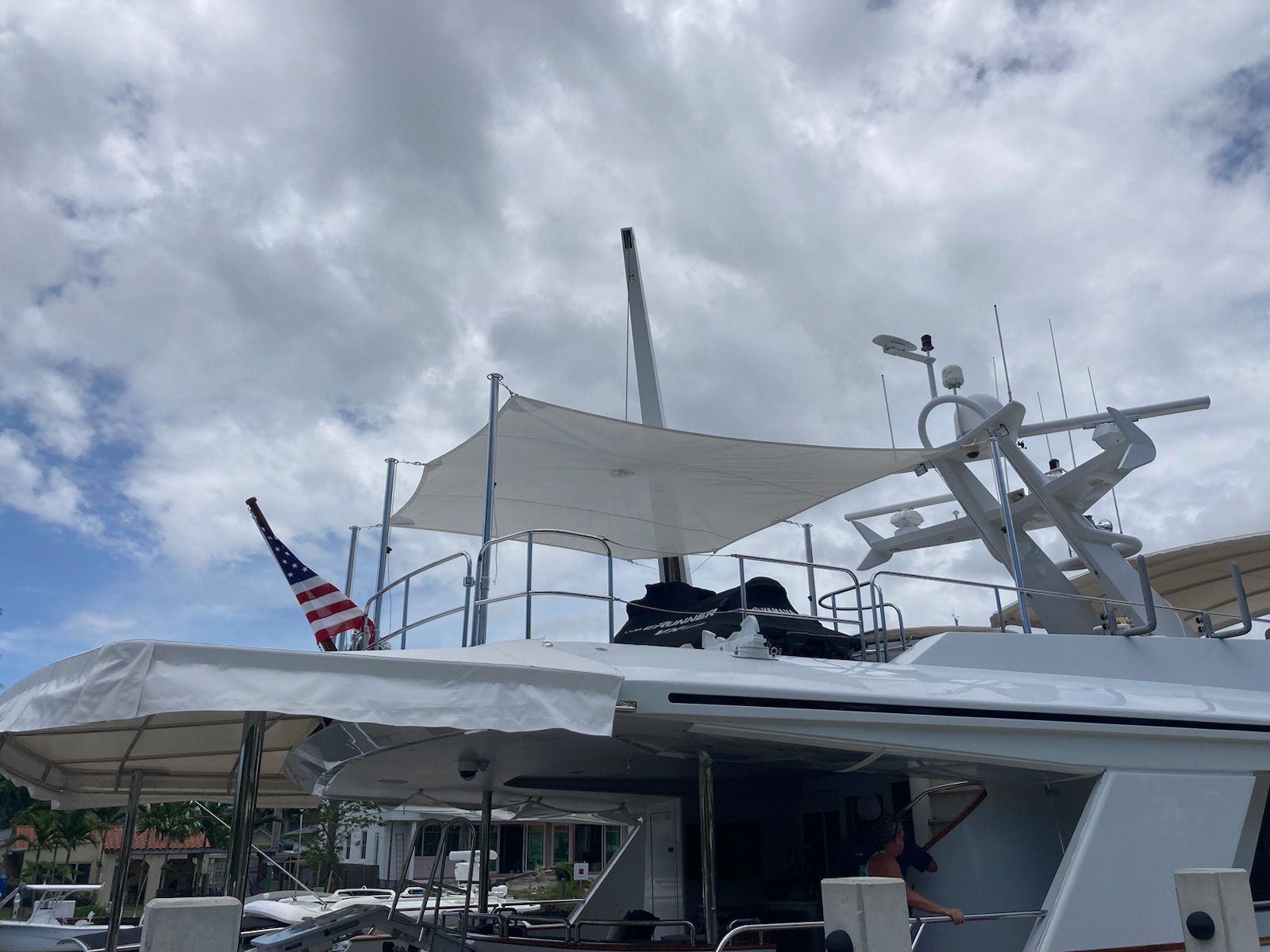 A boat with an american flag on the top of it.