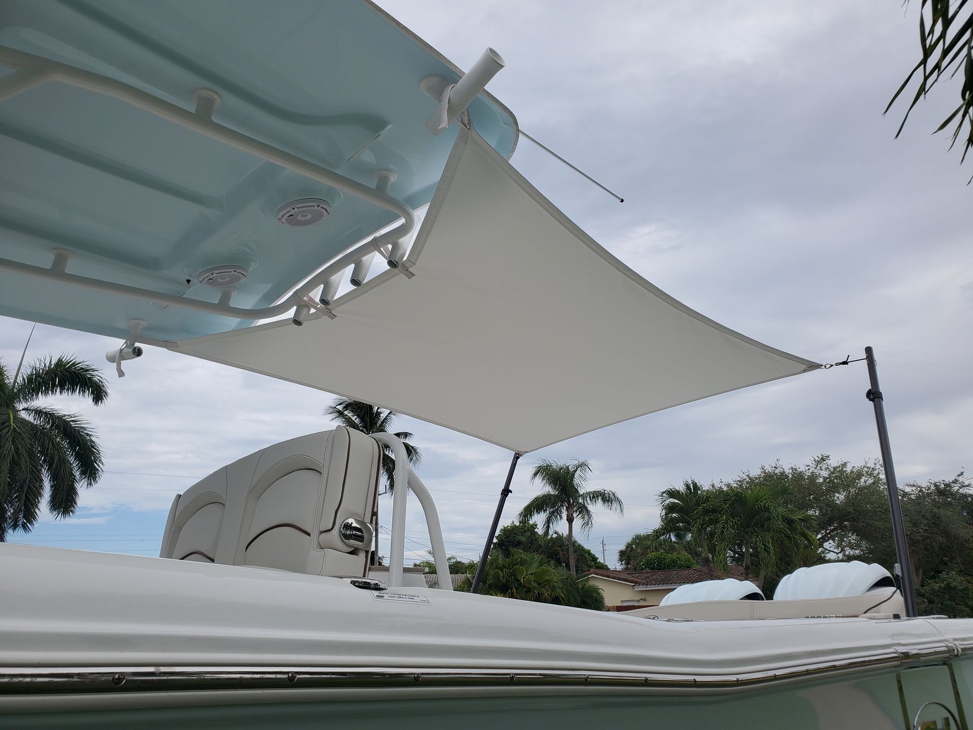 A boat with a white sail on top of it.