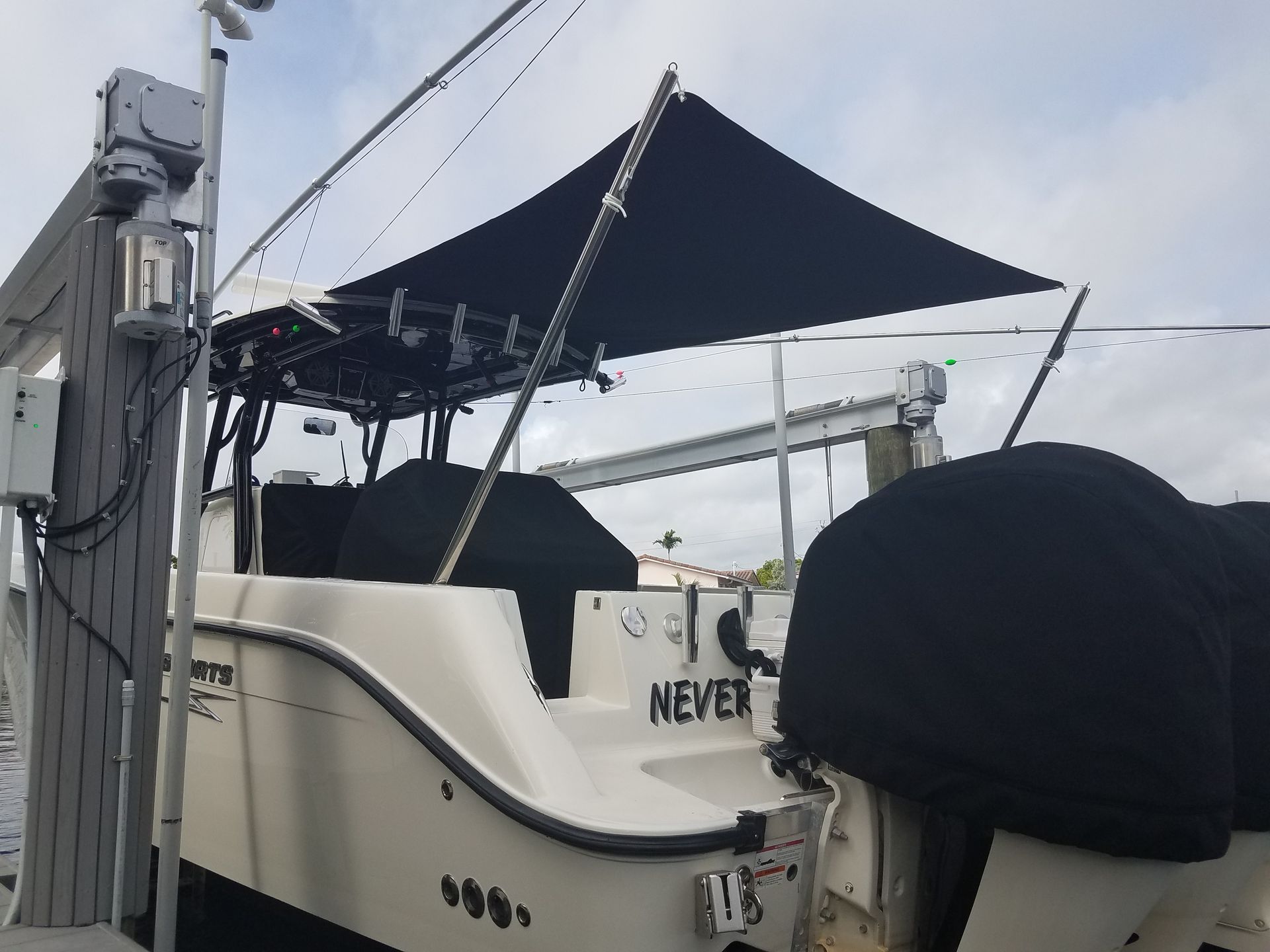 A white boat with the word never on the back