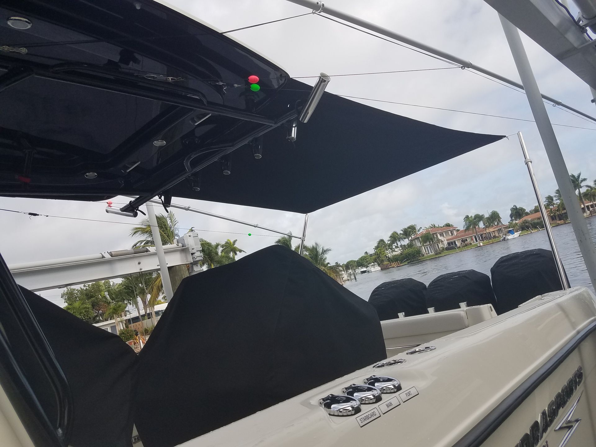 A boat with a black umbrella on top of it