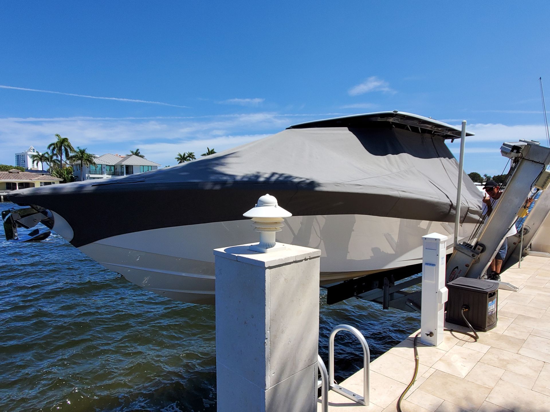 A boat is docked at a dock on a sunny day