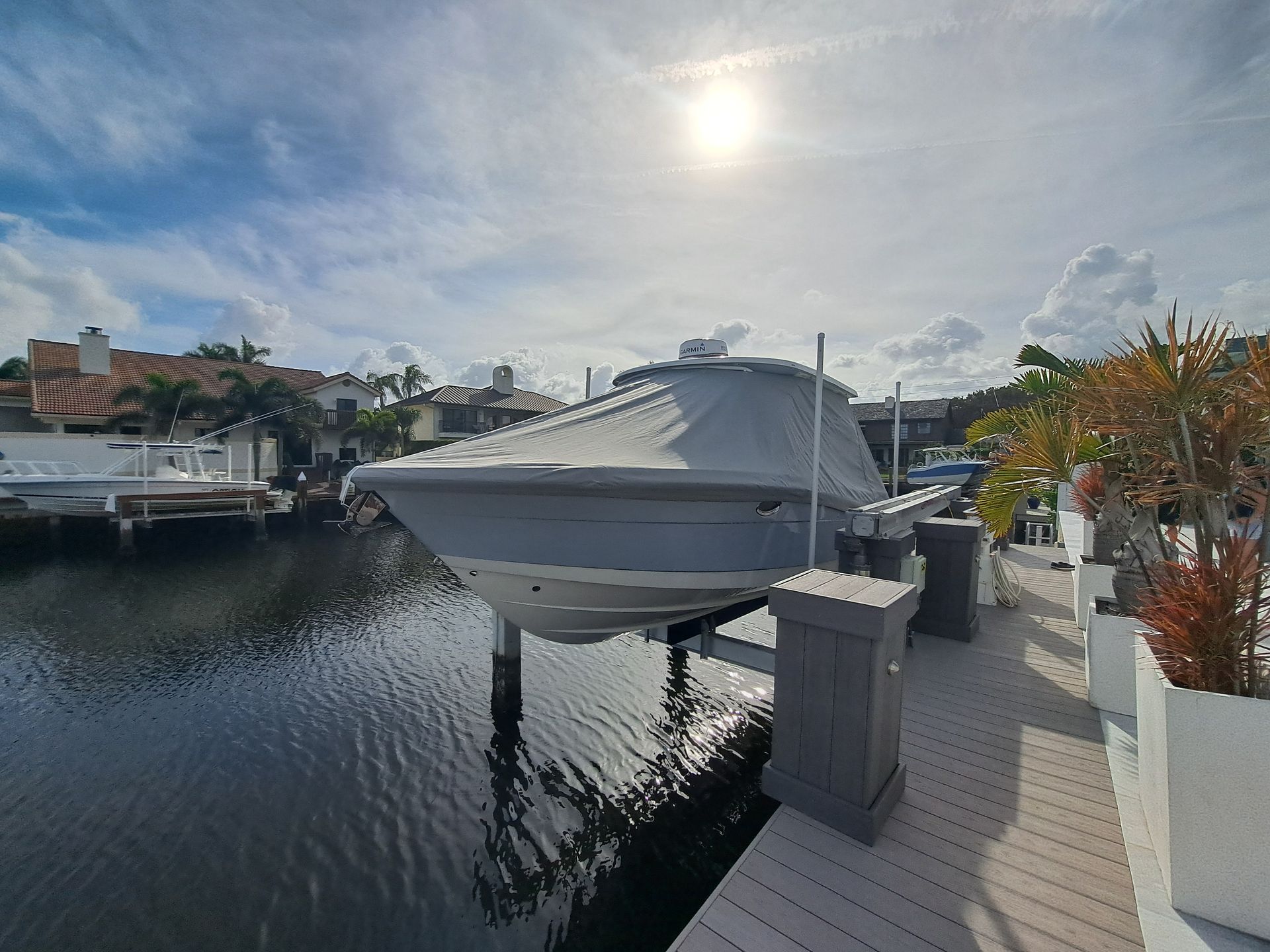 A boat is docked at a dock in the water.