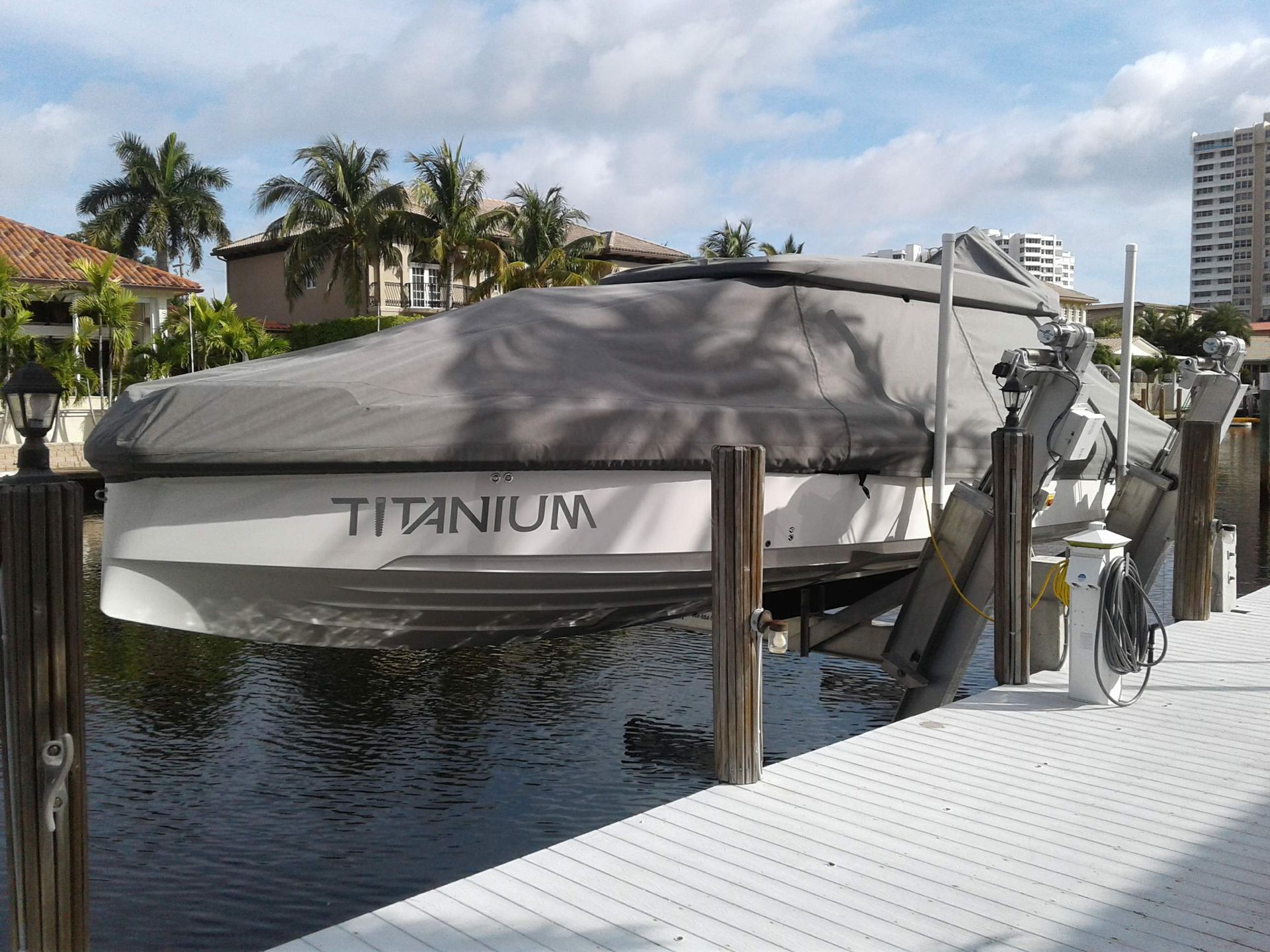 A titanium boat is docked at a dock