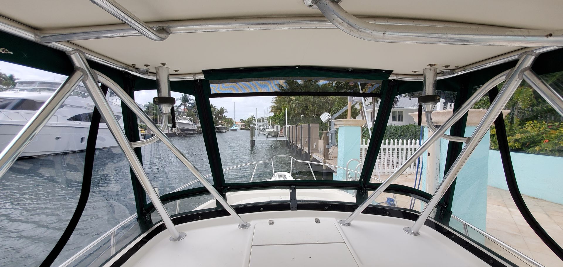 The inside of a boat with a view of the water.