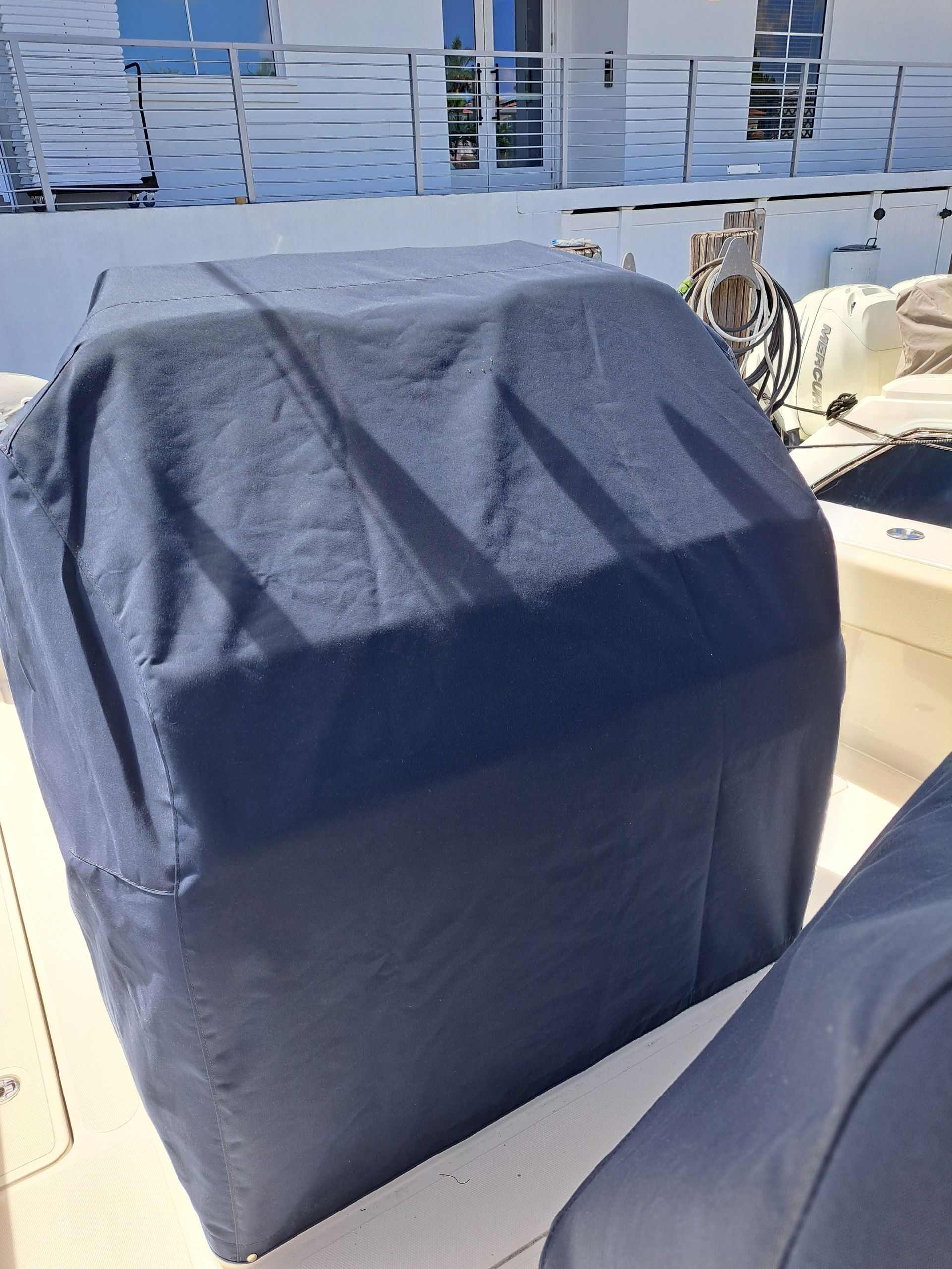 A boat with a blue cover on top of it