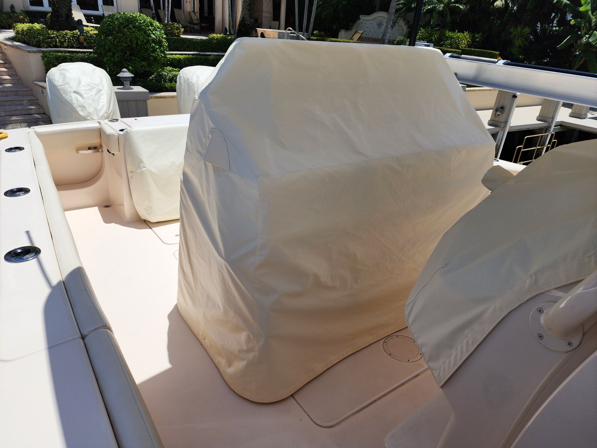 A boat with a white cover on the seats