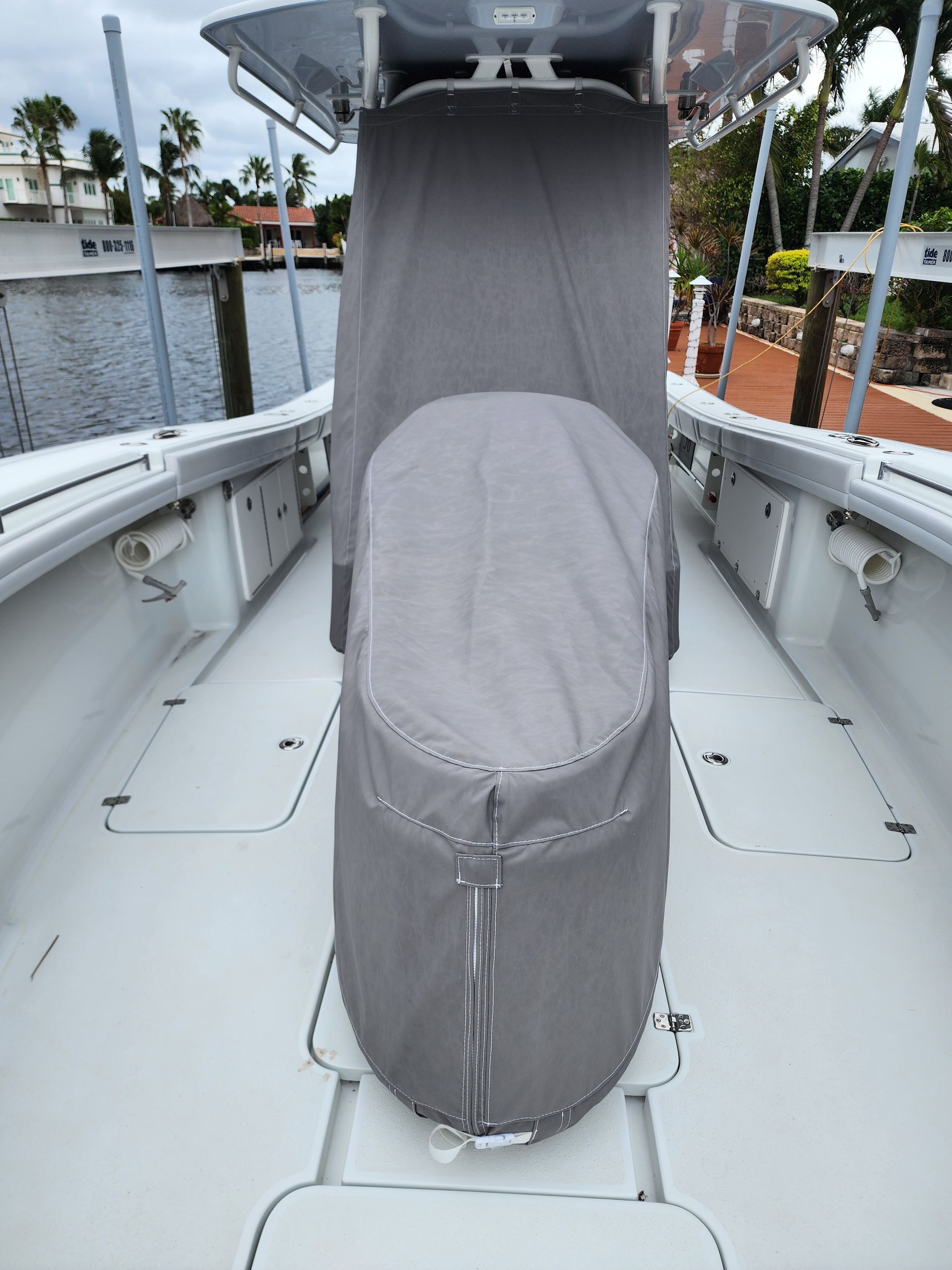 The front of a boat with a seat cover on it