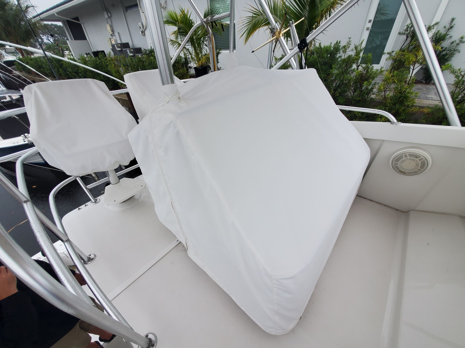 A white cushion is sitting on the front of a boat.