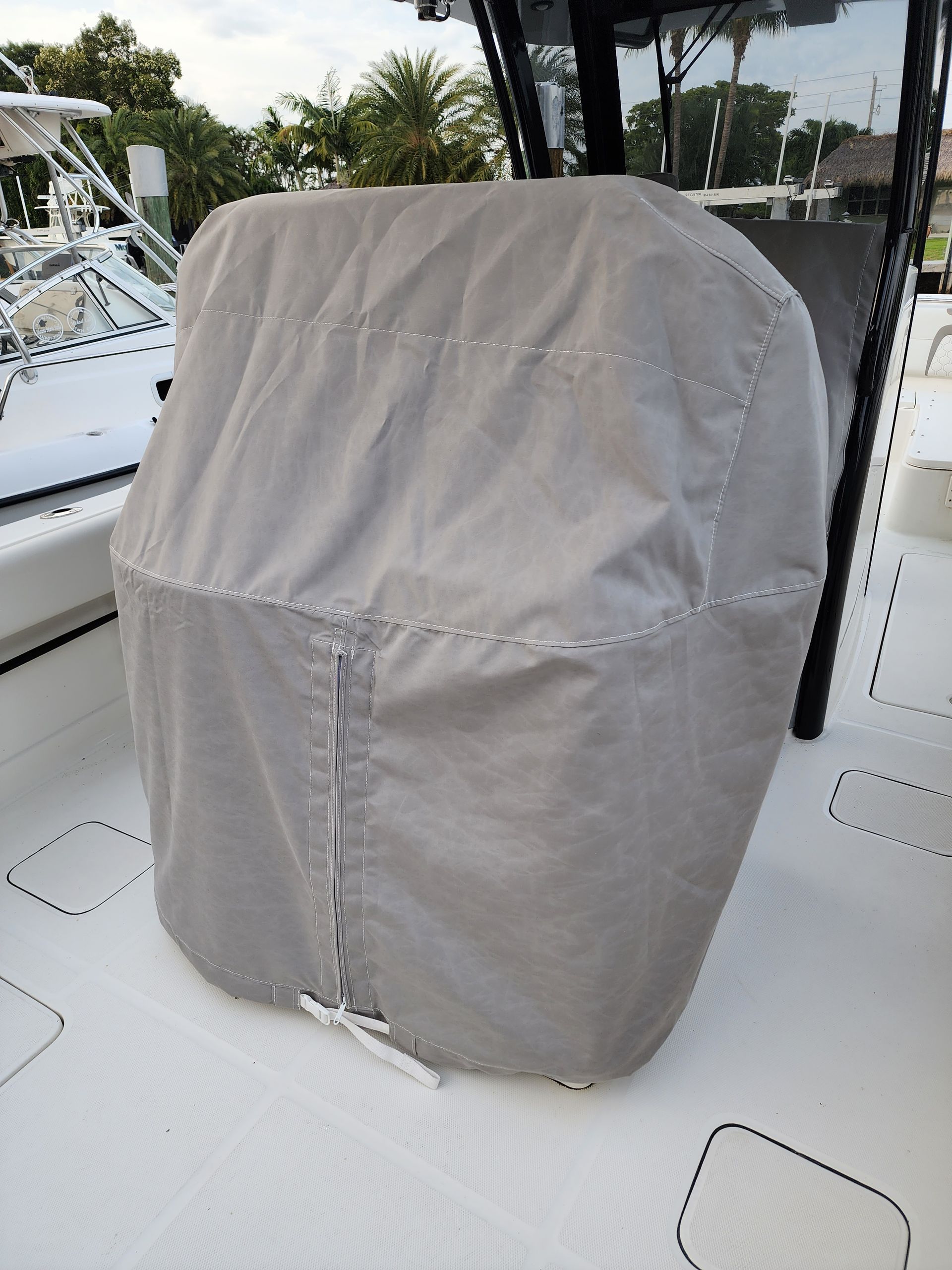 A boat with a seat cover on it