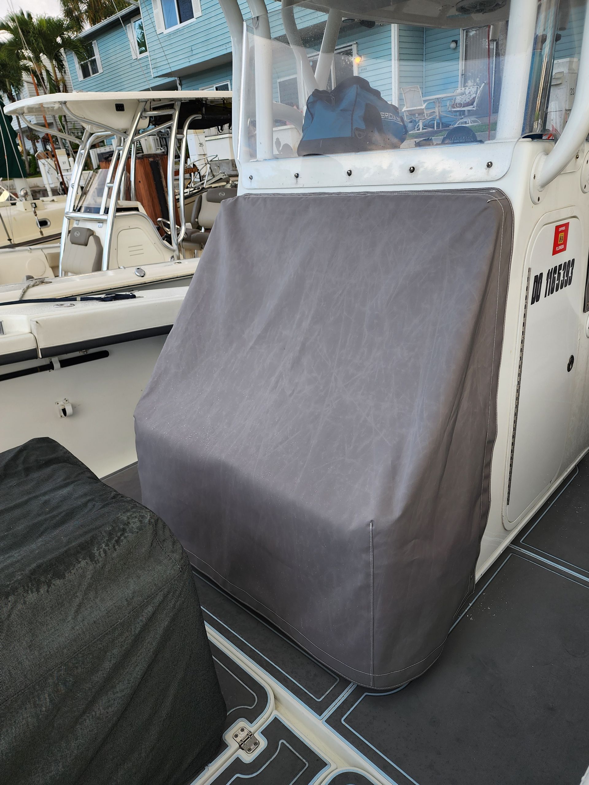 A boat with a cover on the front of it.