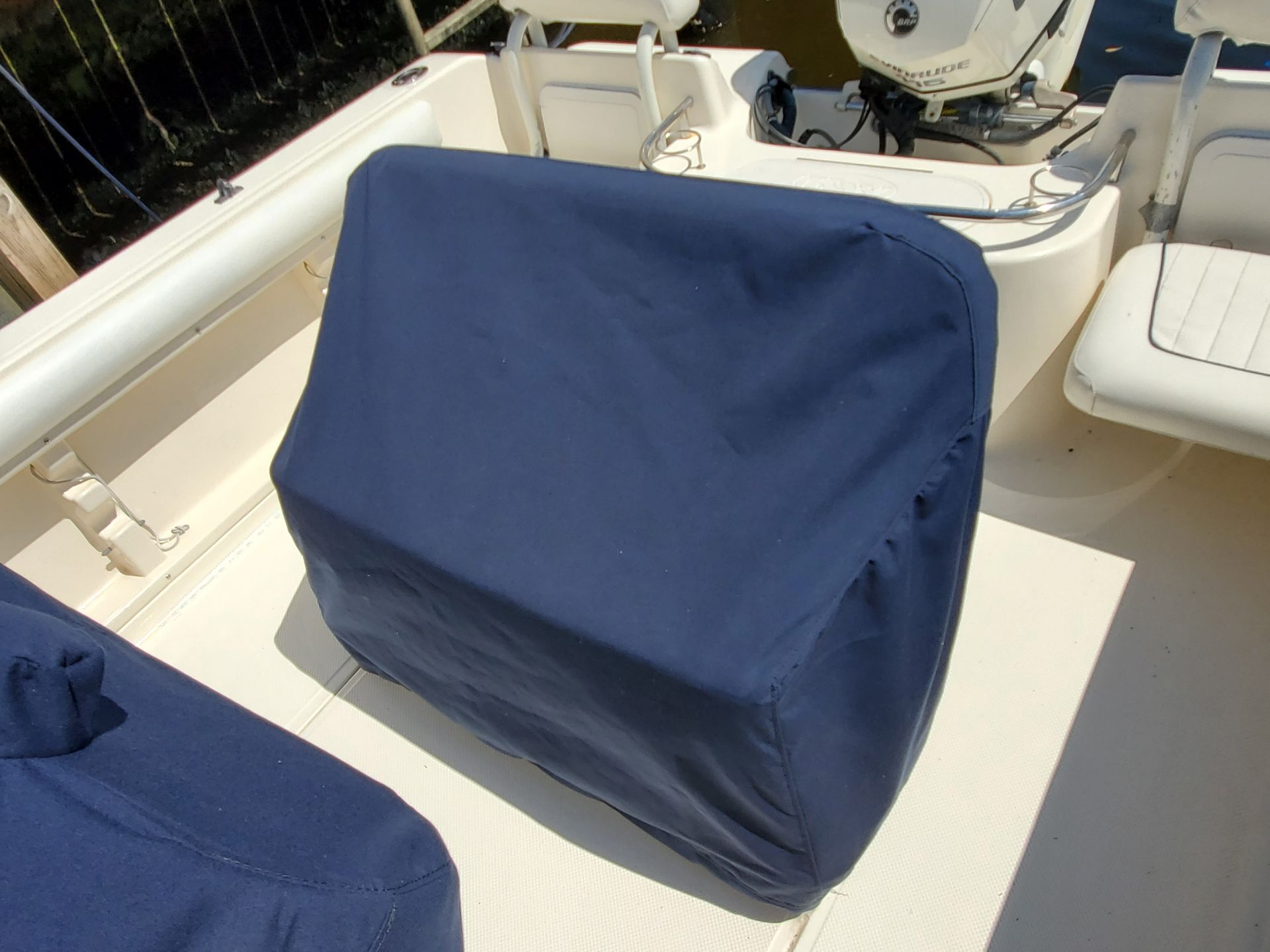 A boat with a blue seat cover on it