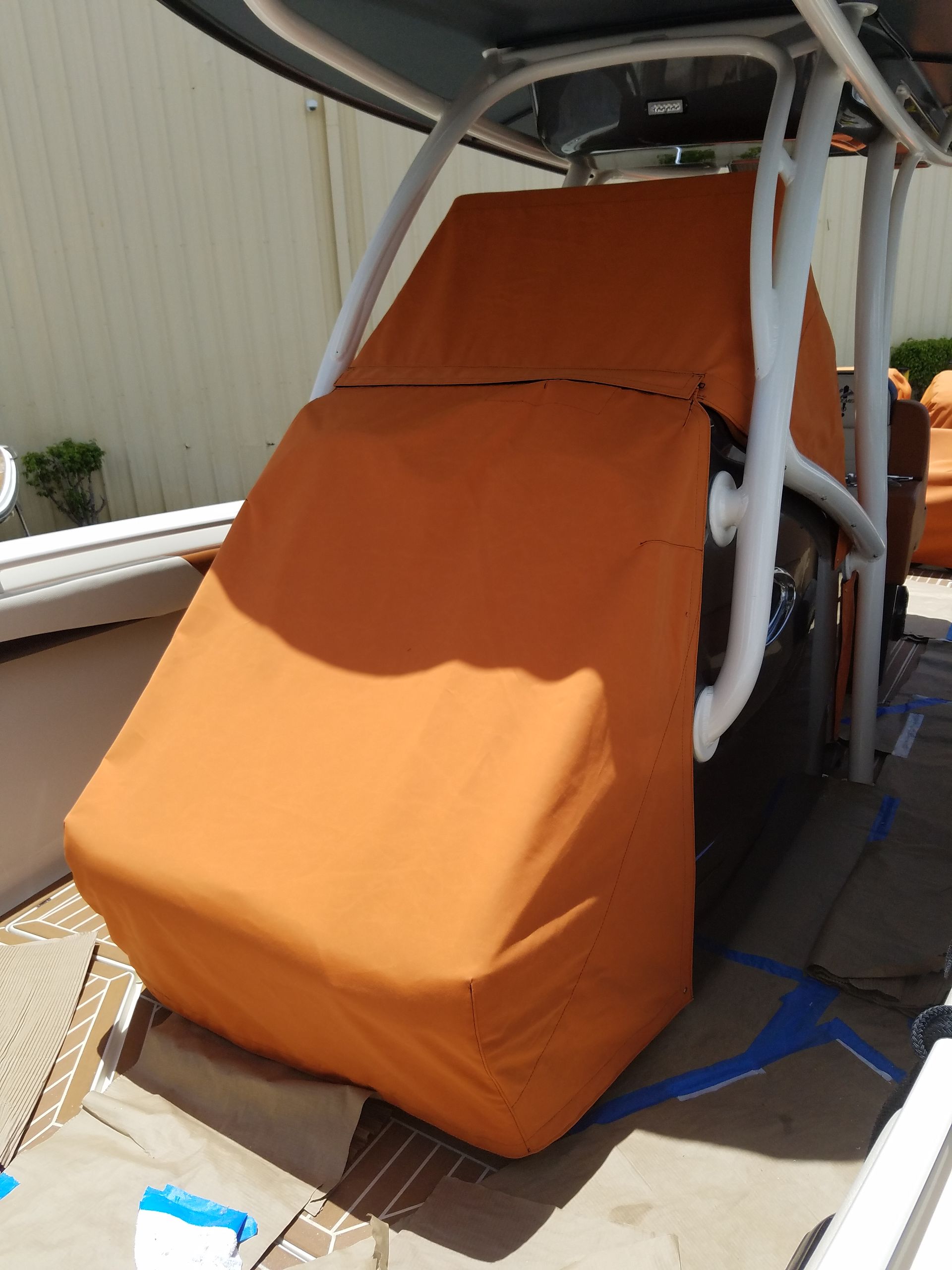 A boat with an orange cover on it