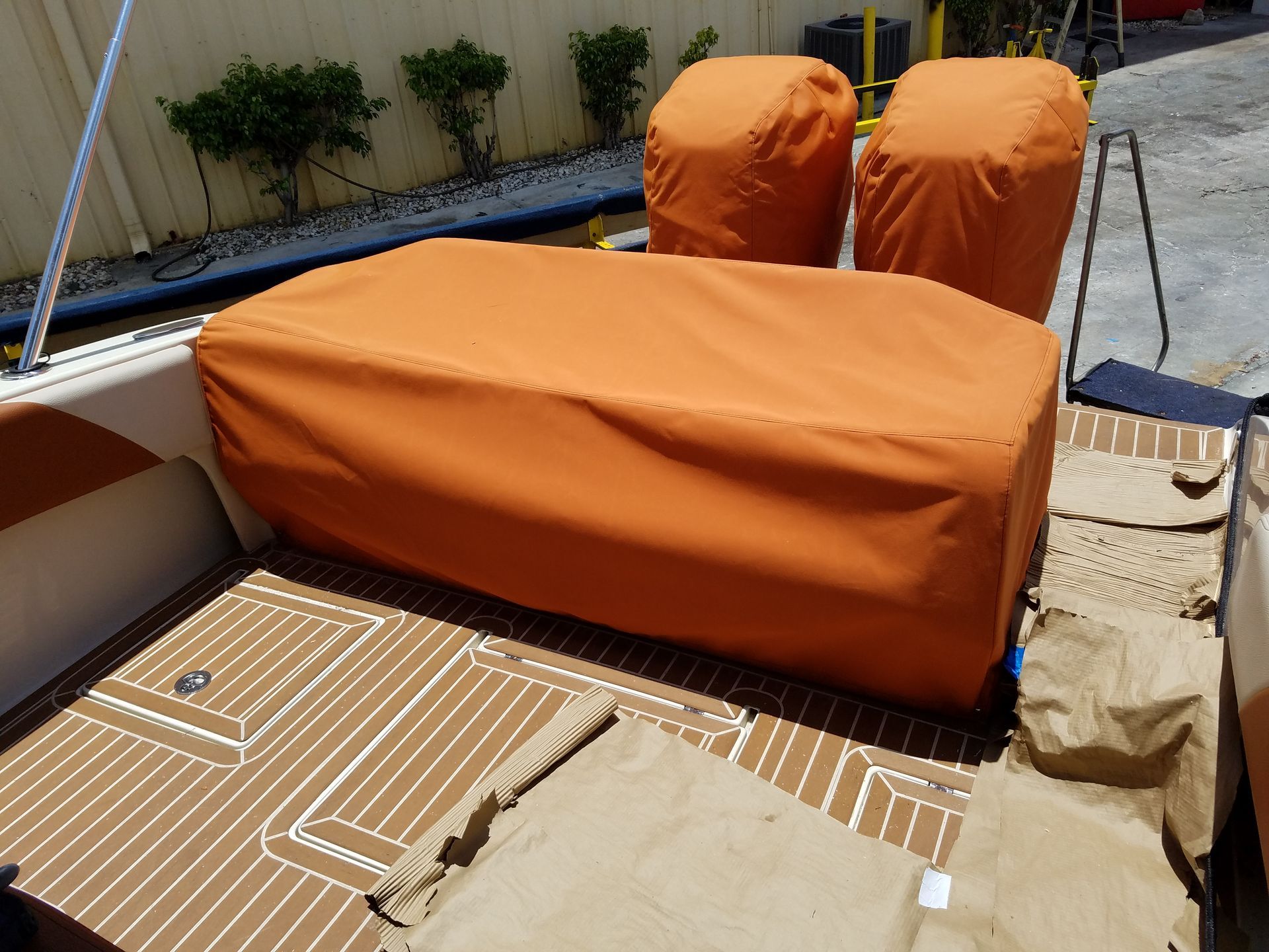 A boat with an orange cover on the seats