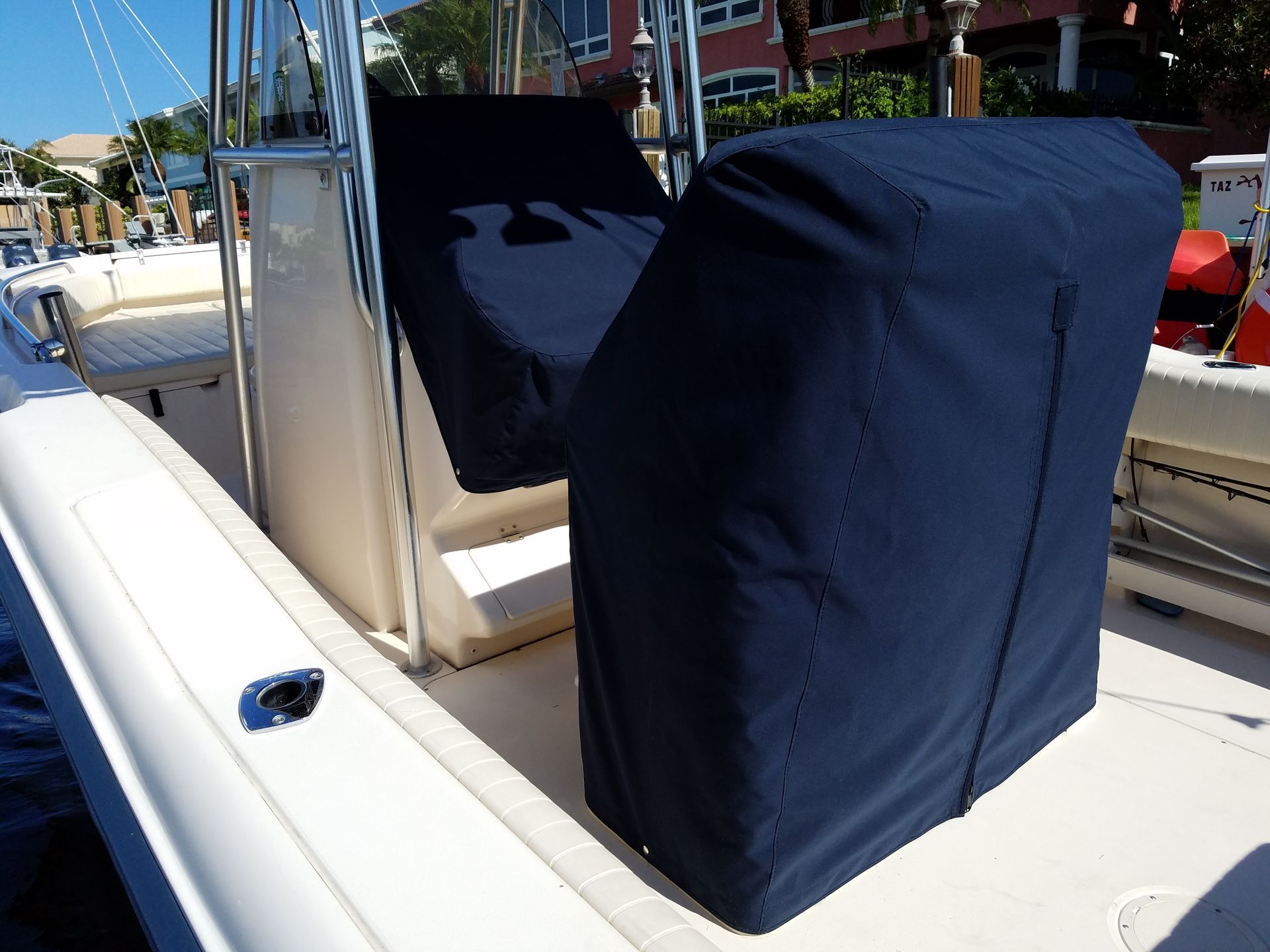 A boat with a blue seat cover on it