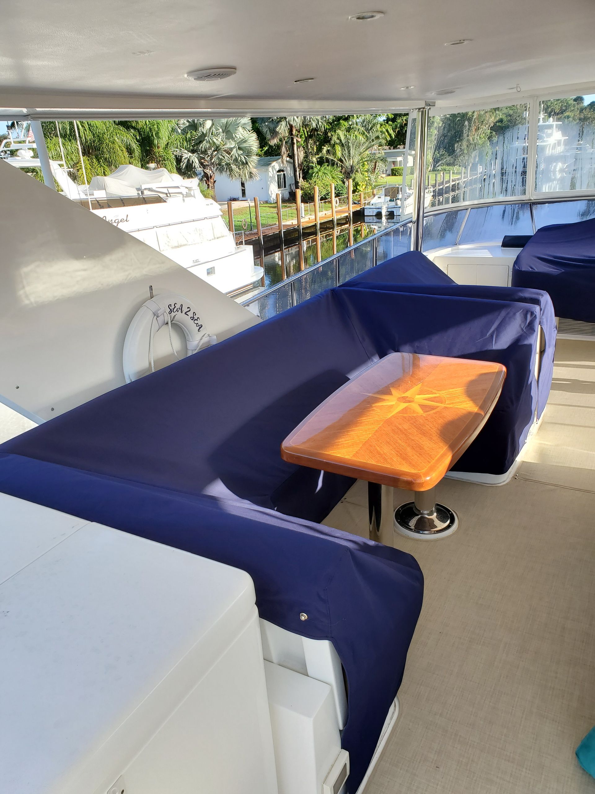 There is a table and a couch on the boat.