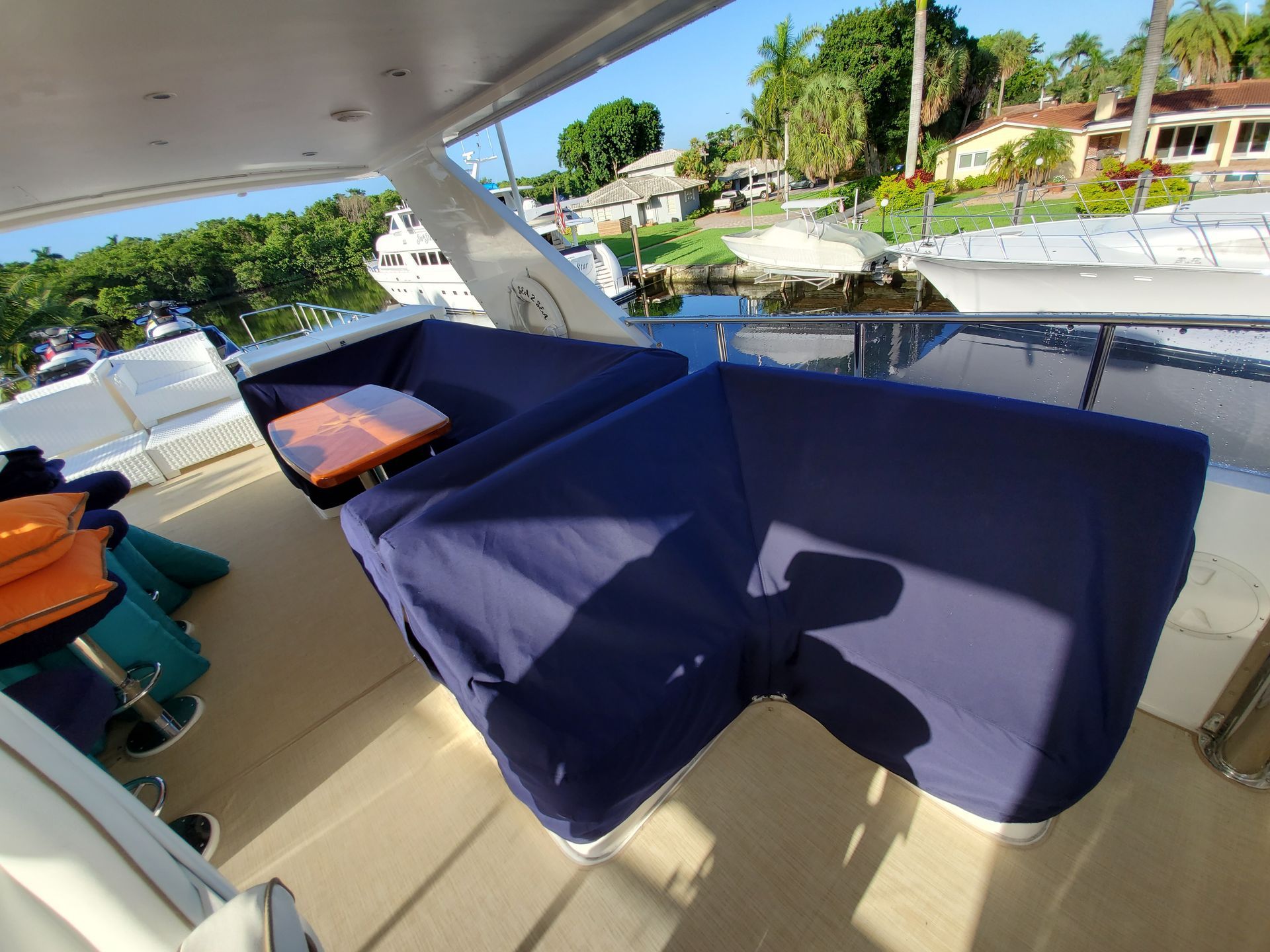 A boat with a couch and a table on the deck
