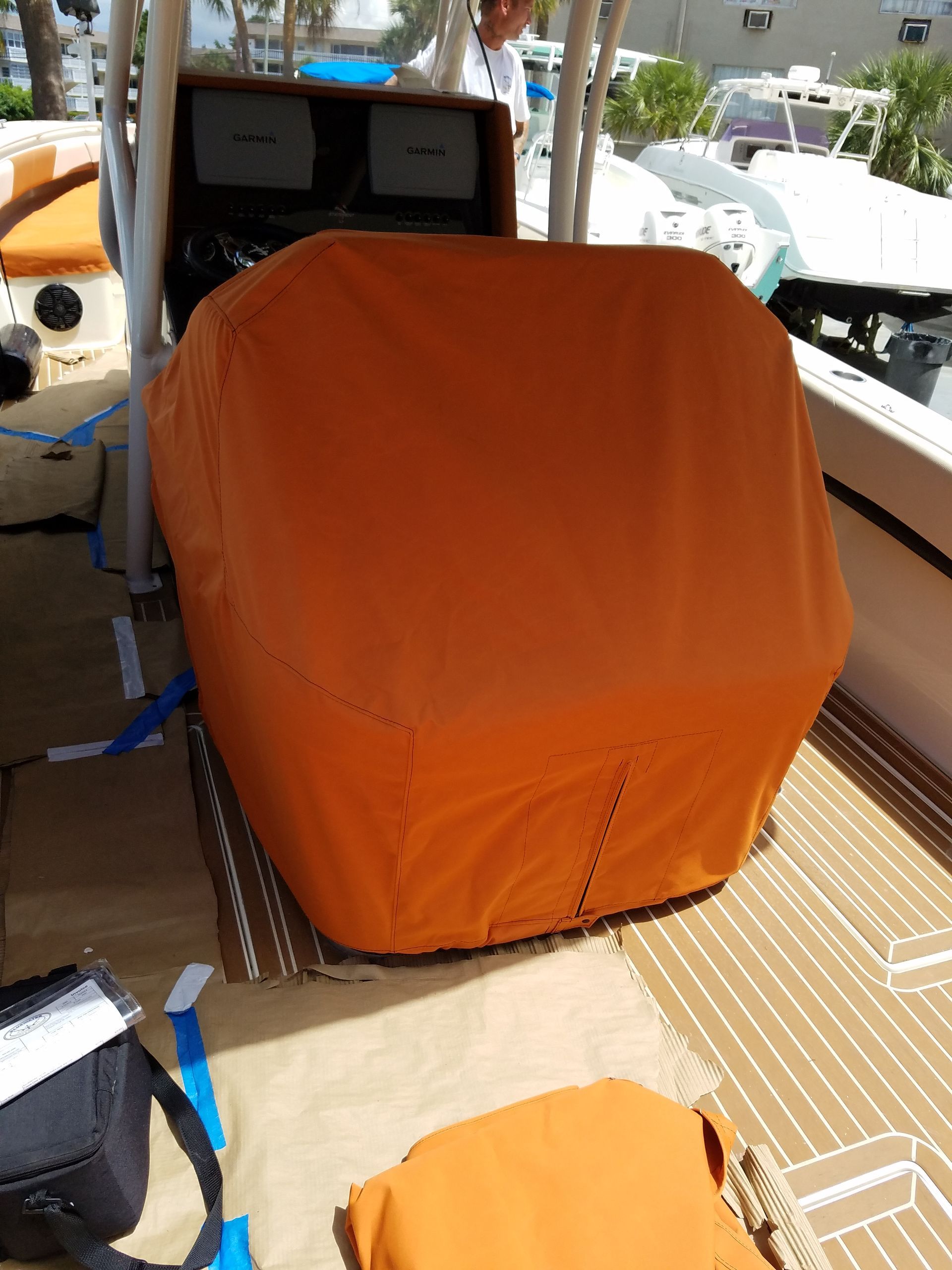 A boat with an orange cover on it