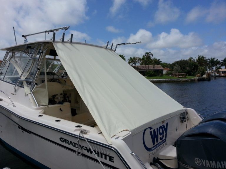 A white boat with the word wgy on the back