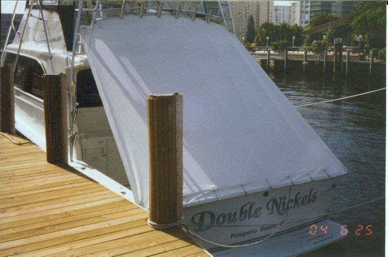 A boat named double nickels is docked at a dock