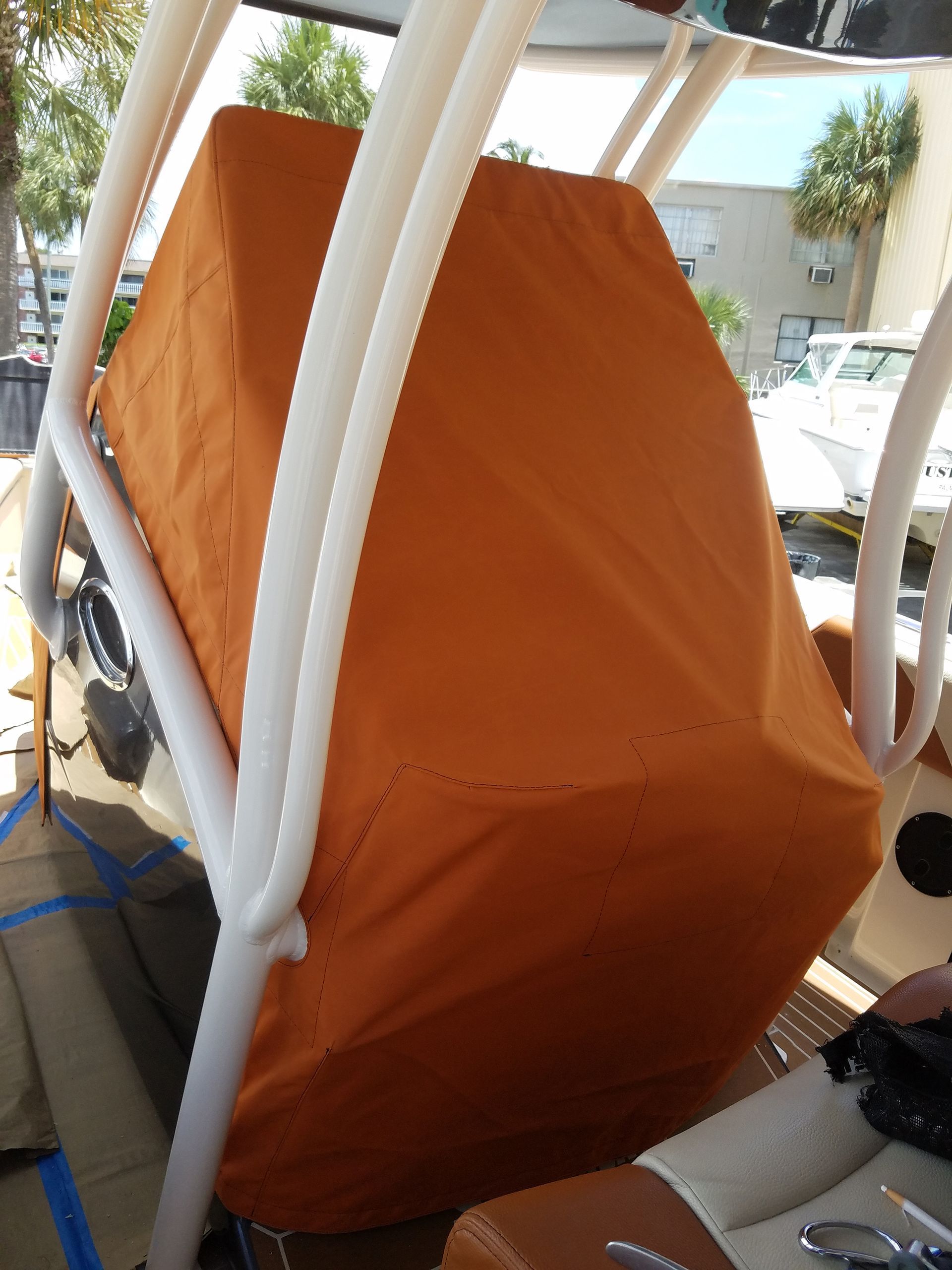 A boat with an orange cover on top of it