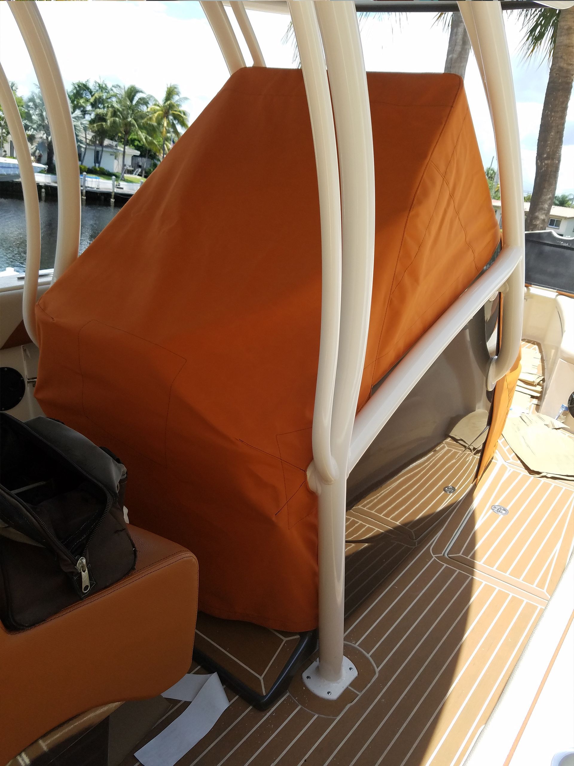 A boat with an orange cover on it