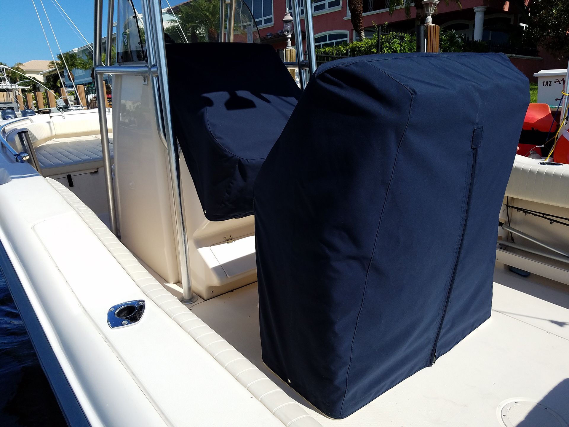 A boat with a blue seat cover on it