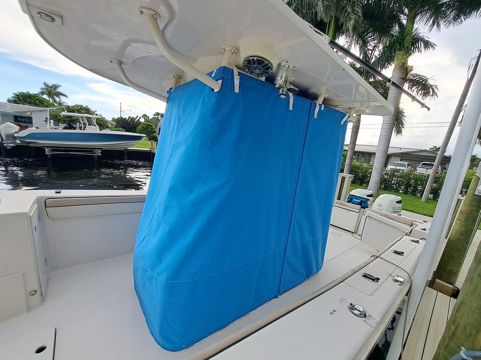 A blue bag is sitting on the back of a boat.