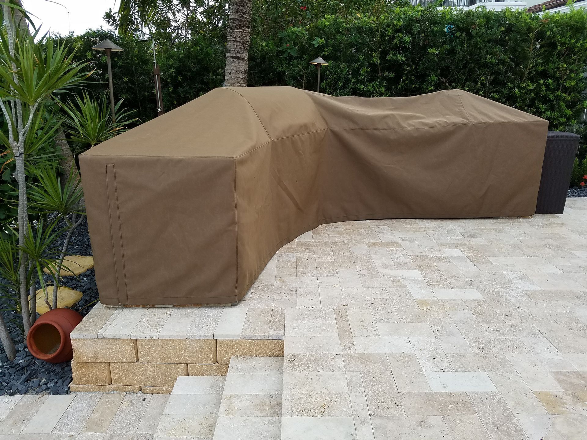 A patio with a brown cover on it