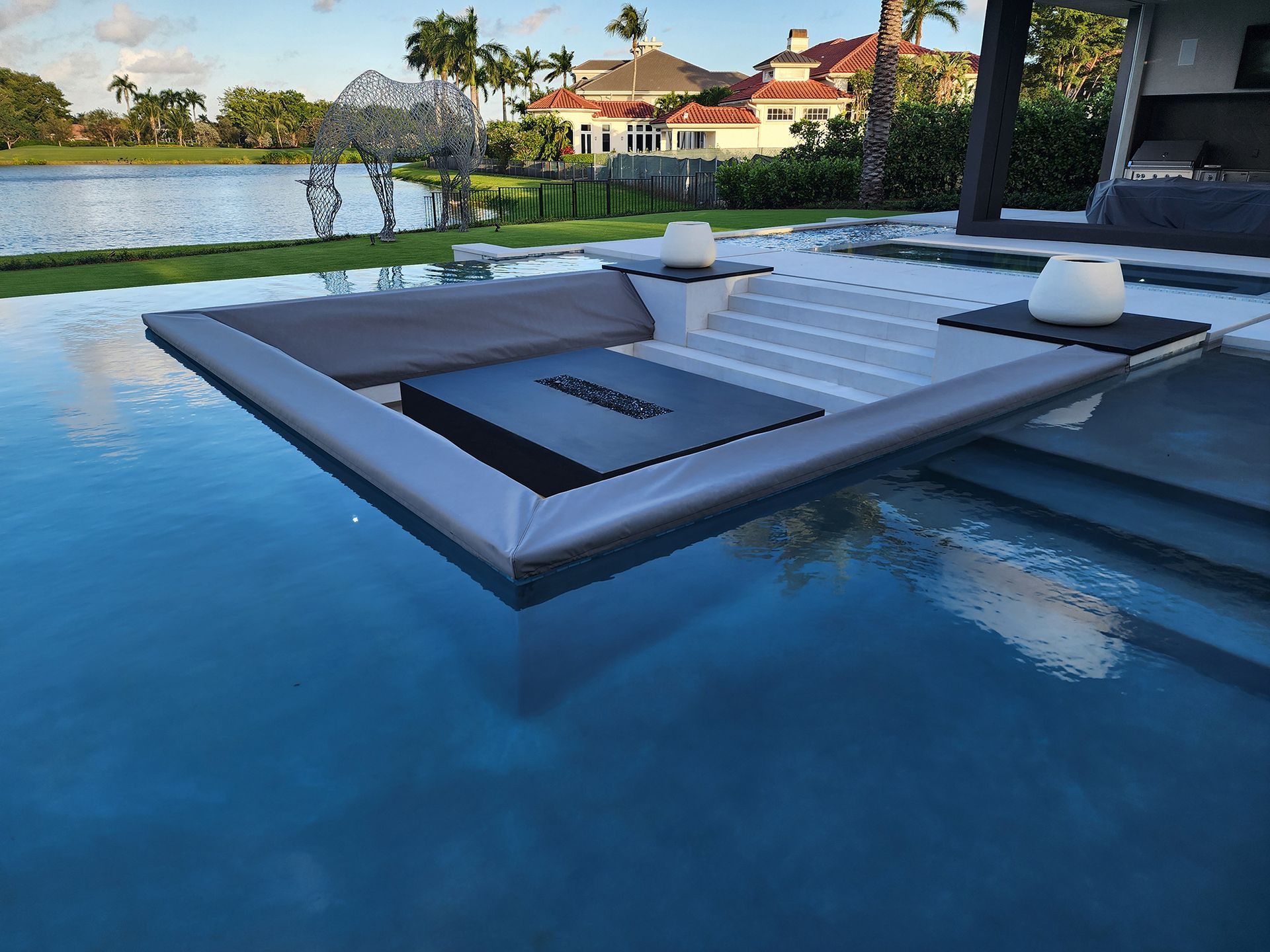 A large swimming pool with a boat in the middle of it