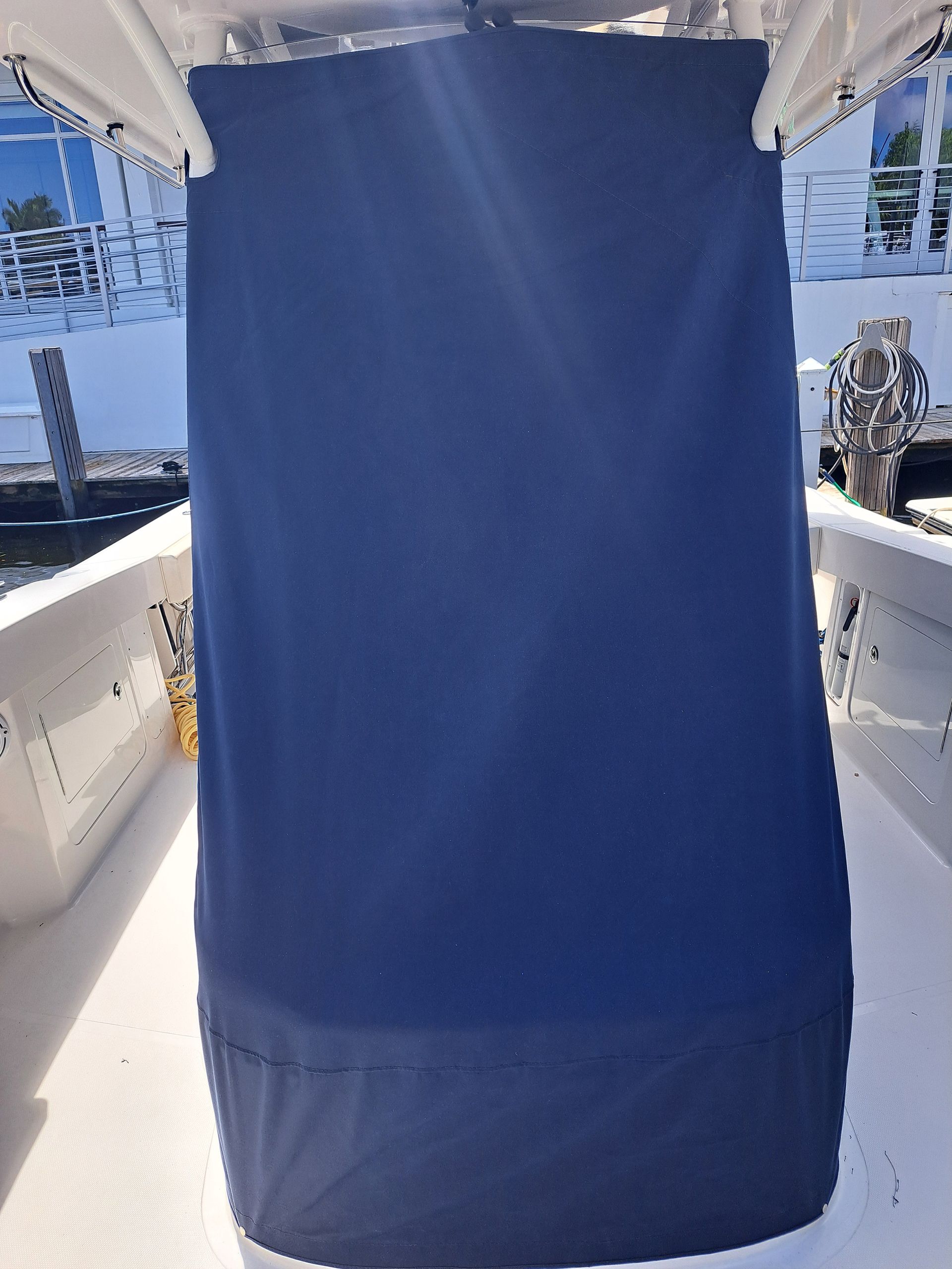 A blue curtain is hanging on the side of a boat