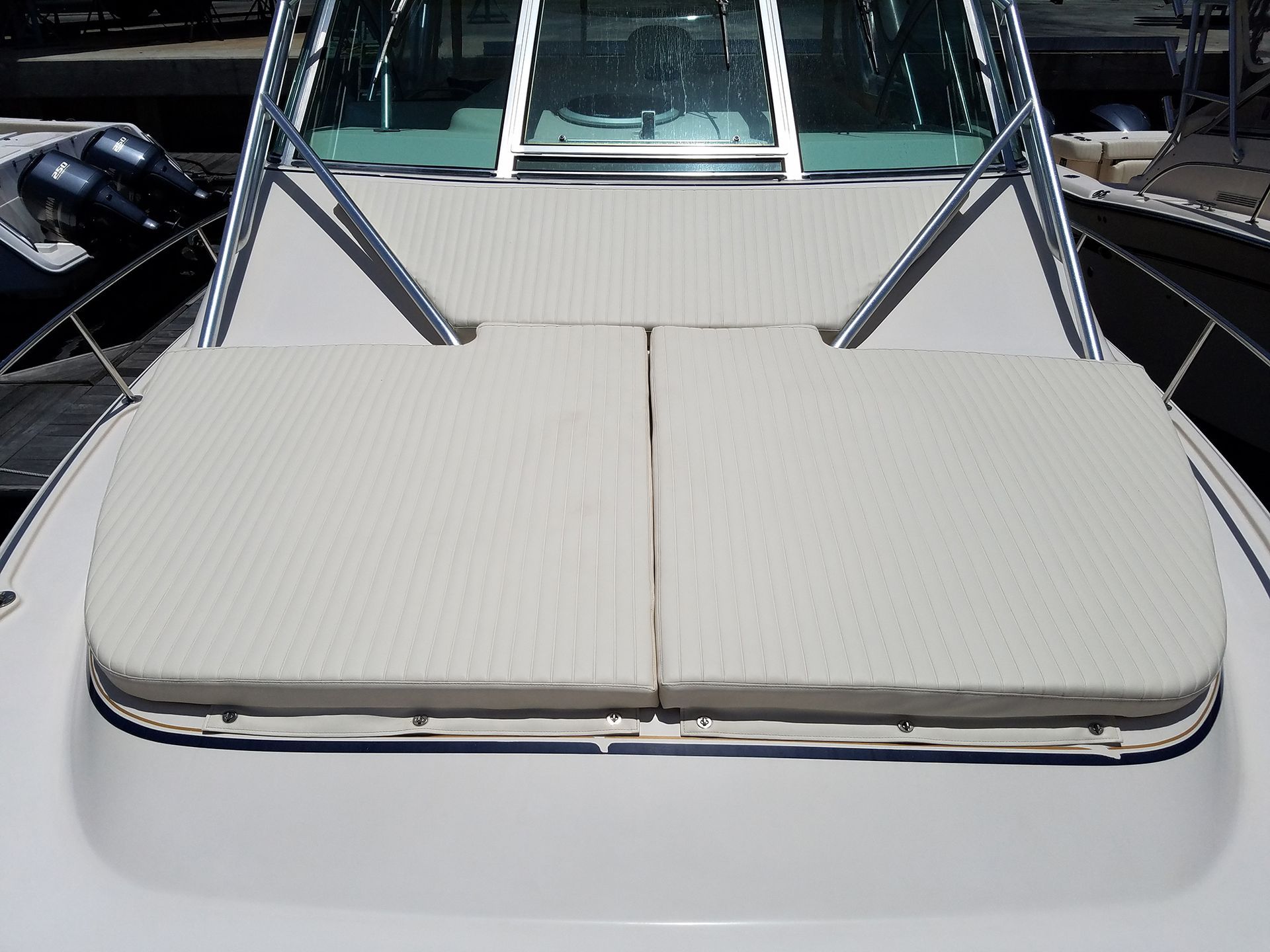 A boat with a cushion on the front of it