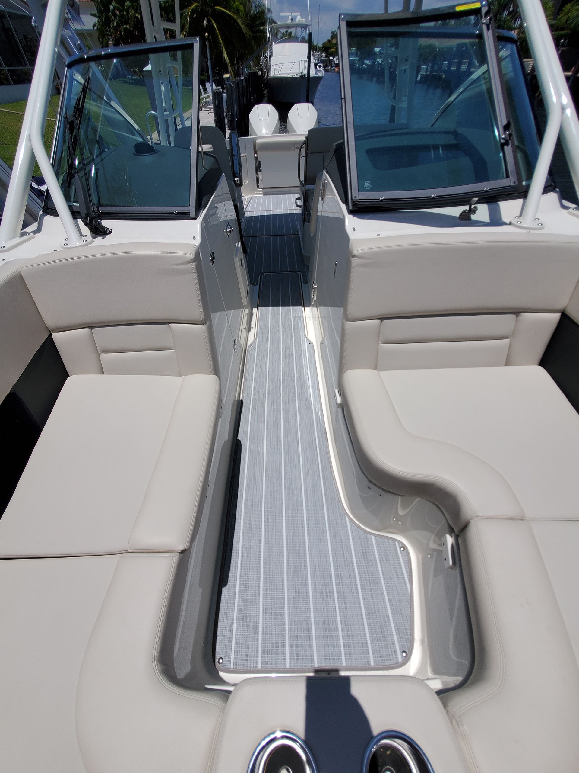 The inside of a boat with a staircase leading to the back of the boat