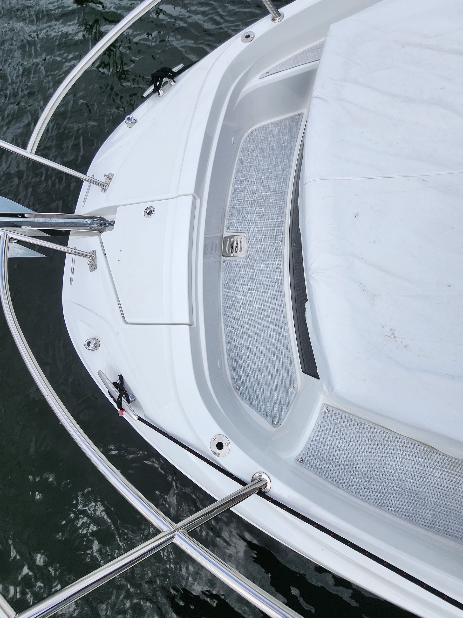 An aerial view of a white boat in the water
