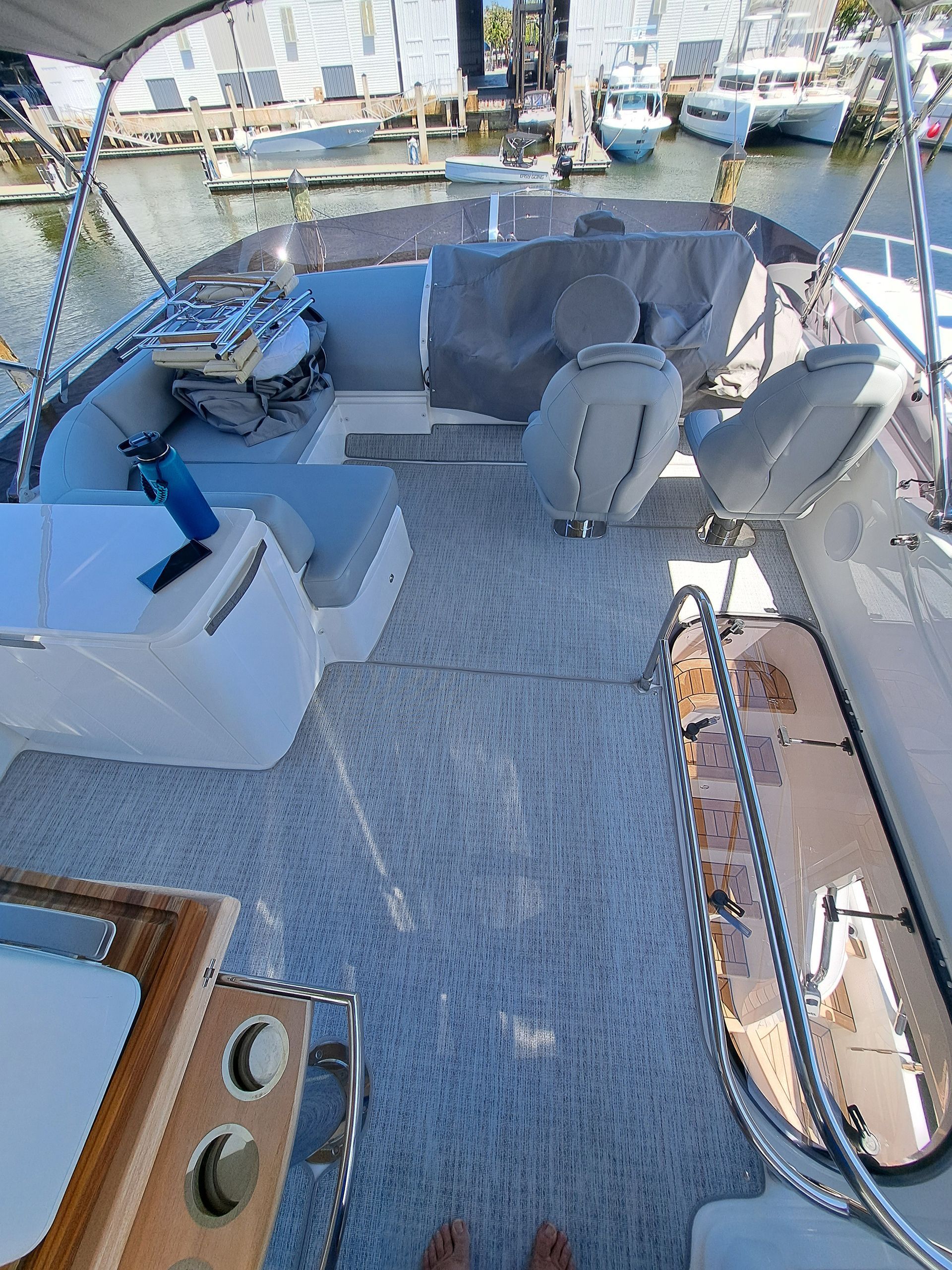 A person is standing on the deck of a boat.