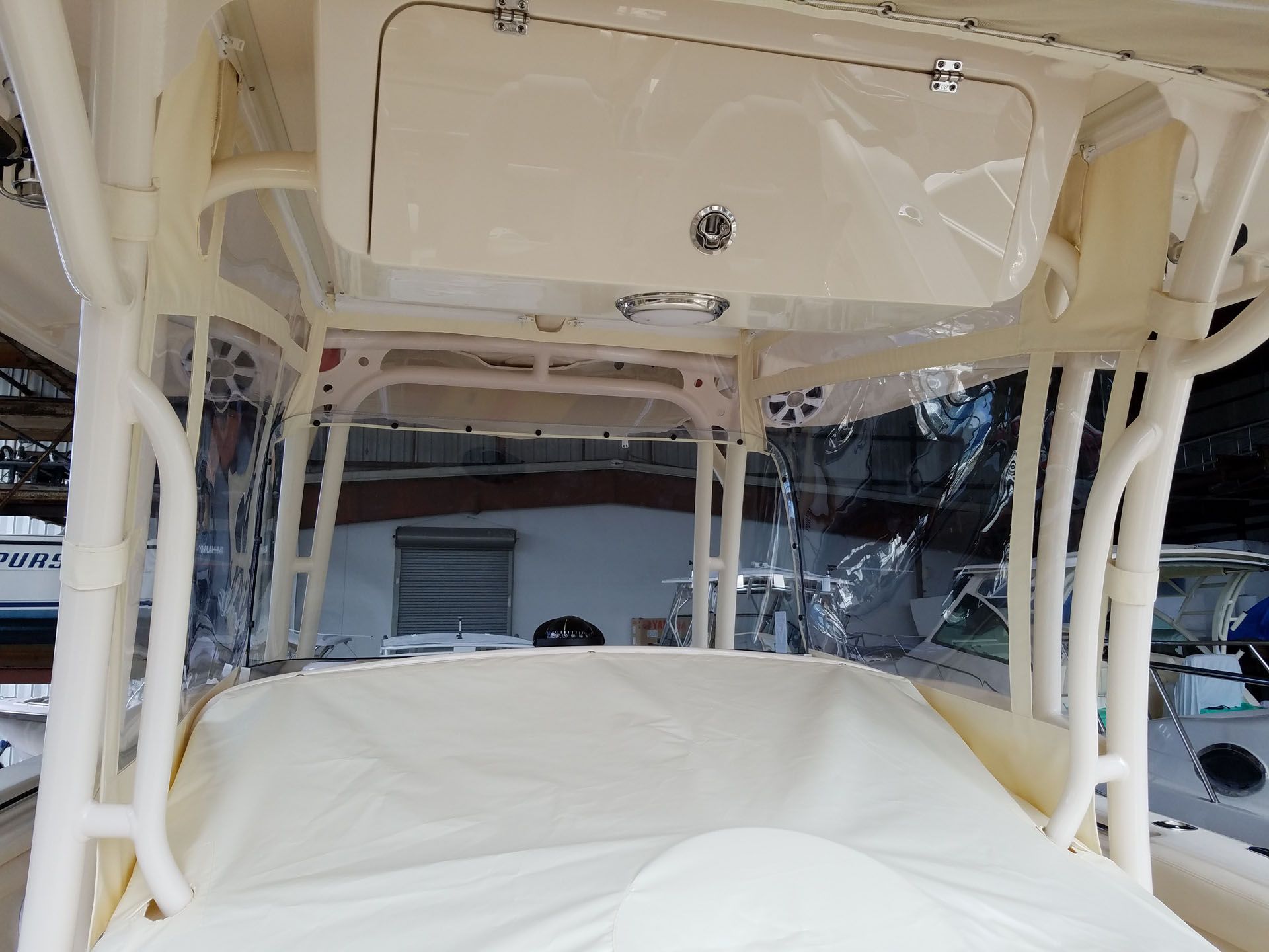 Boat cabin with beige structure and clear plastic enclosures; interior view.