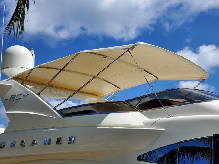 A white boat with the word dreamer on the side