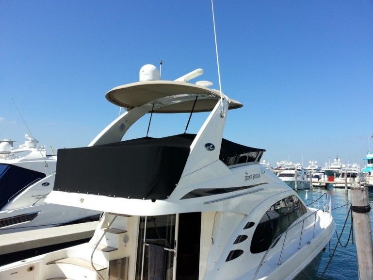 A white yacht with the word scenic on the side