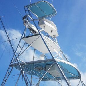 A boat with a blue canopy on top of it