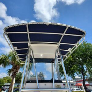 A boat with a blue canopy on top of it